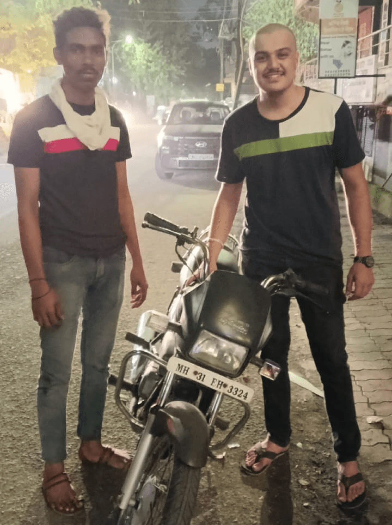 A happy customer along with Kothari Automobile's representative