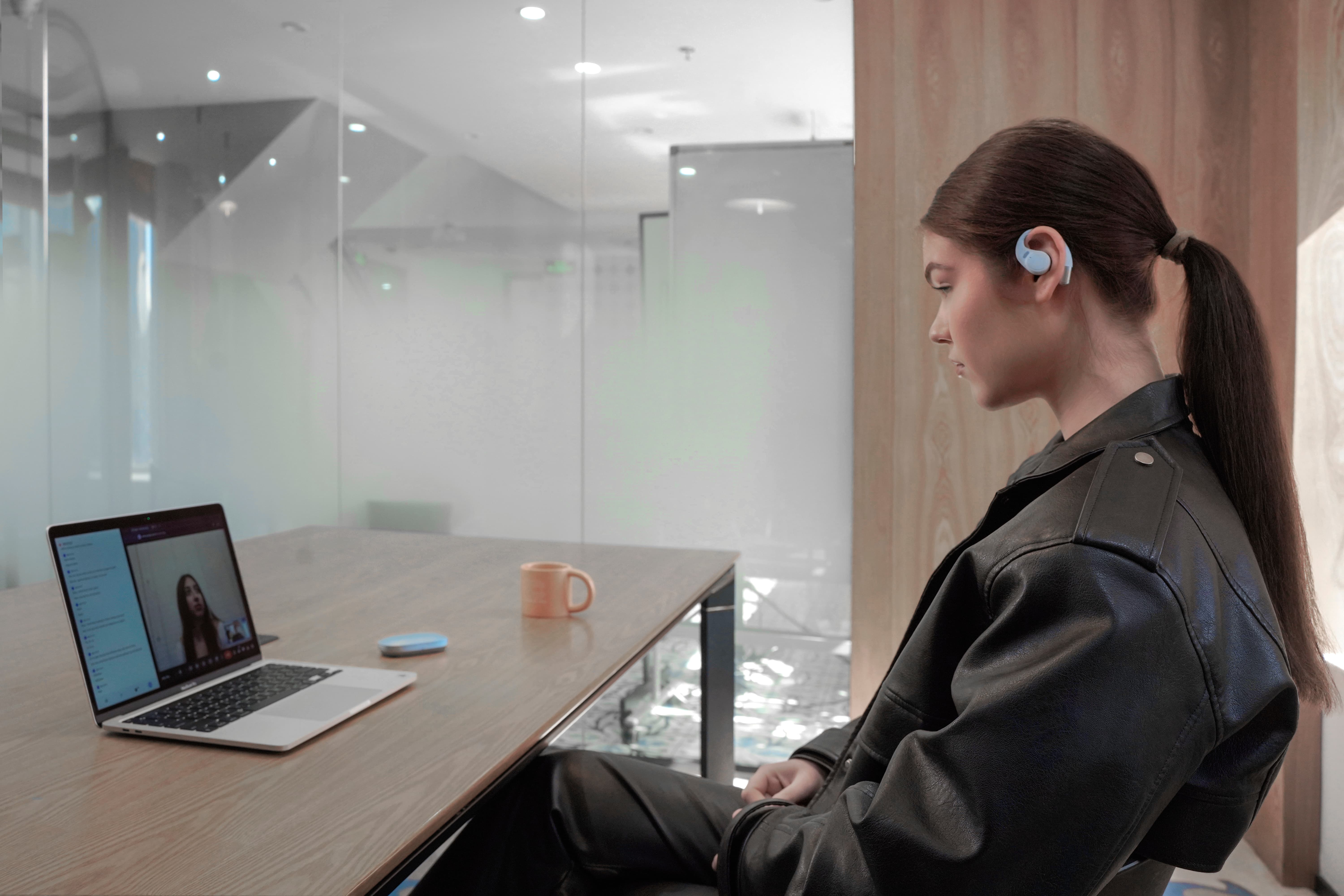 a light blue clock on a blue surface