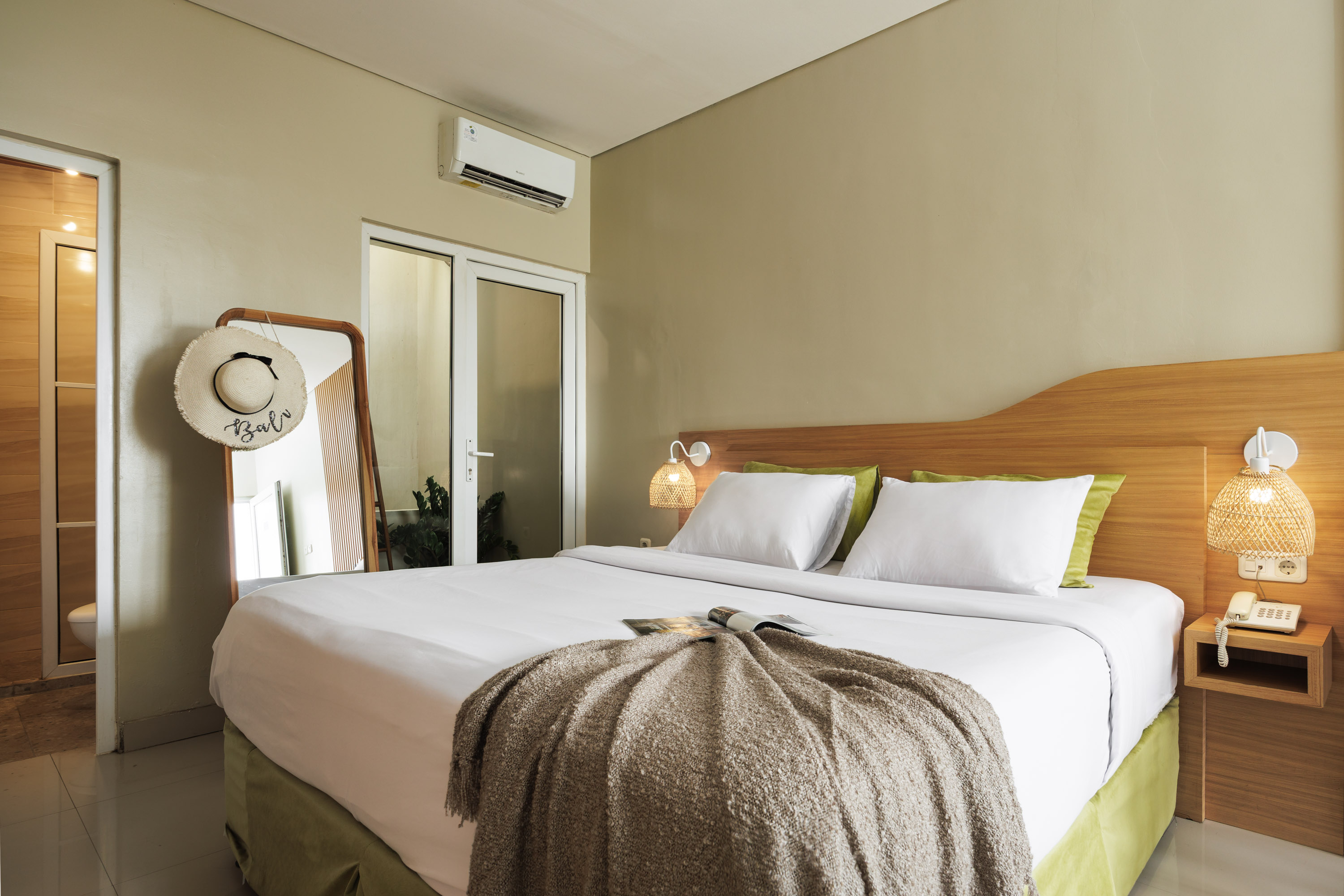 “Apartment sofa and bed view, natural light interior in Bali”