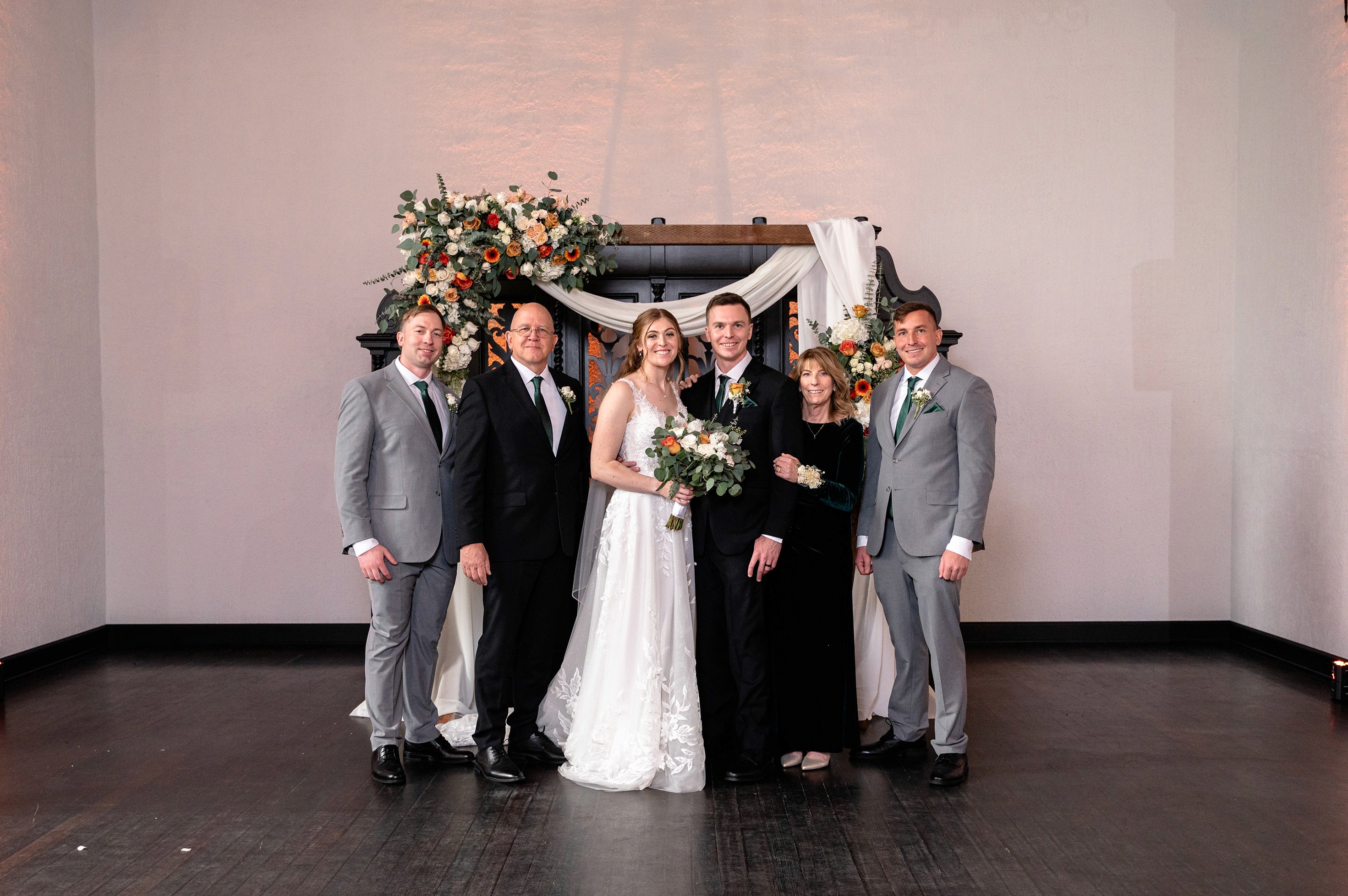 Flat lay wedding details with bouquet, rings, and sparkling bridal heels