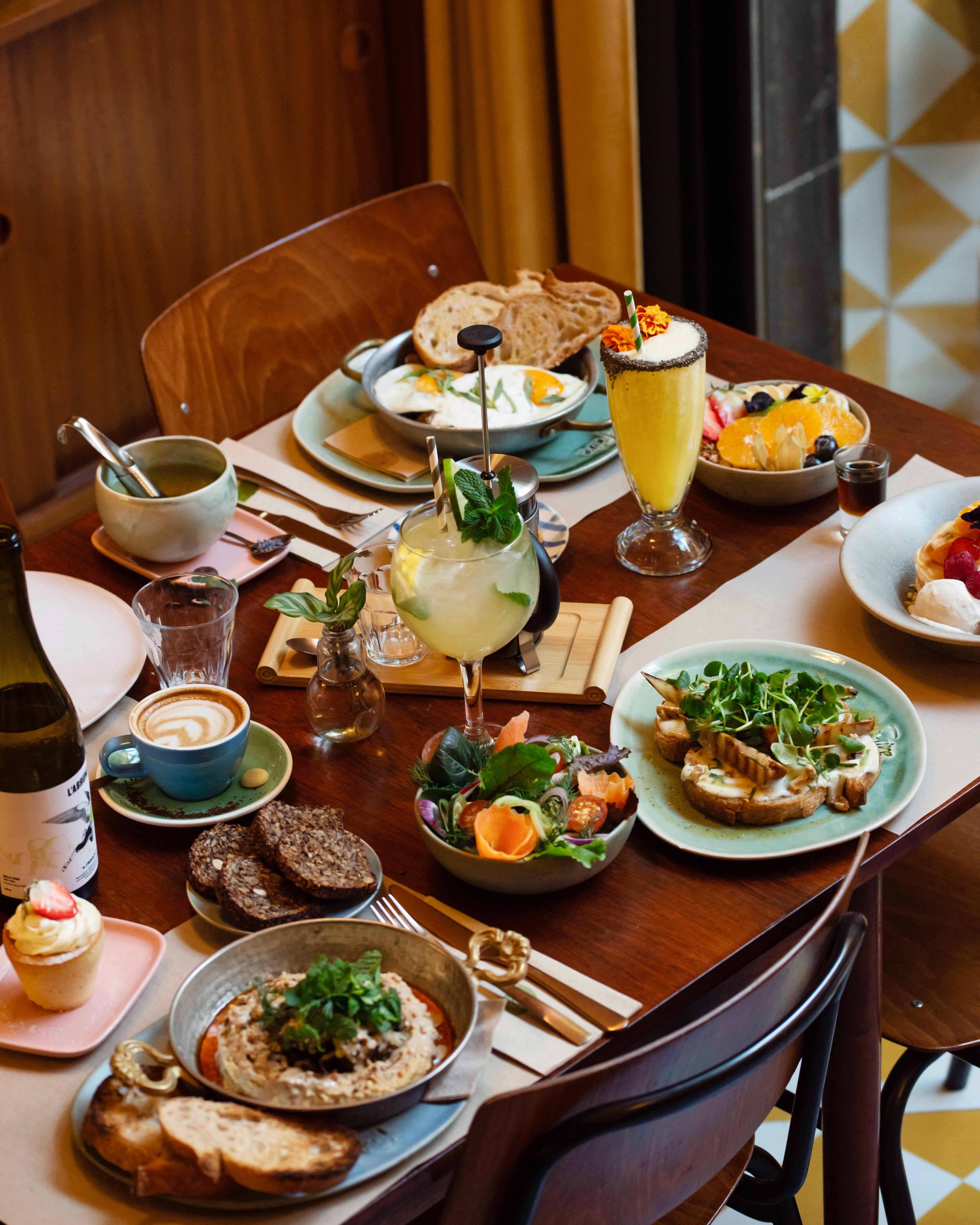 Vegetarian brunch spread with specialty coffee and cocktails at Faire. Brunch & Drinks