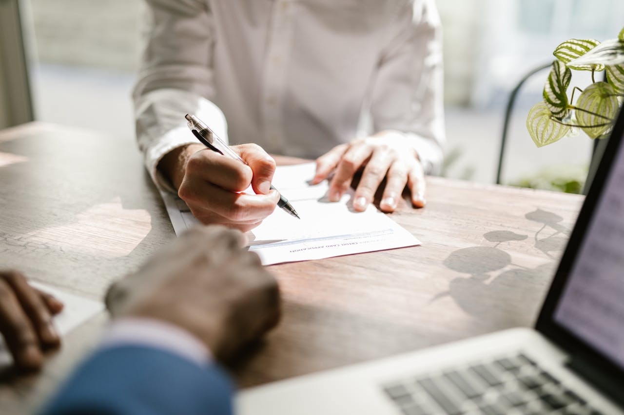 A dentist signing a contract