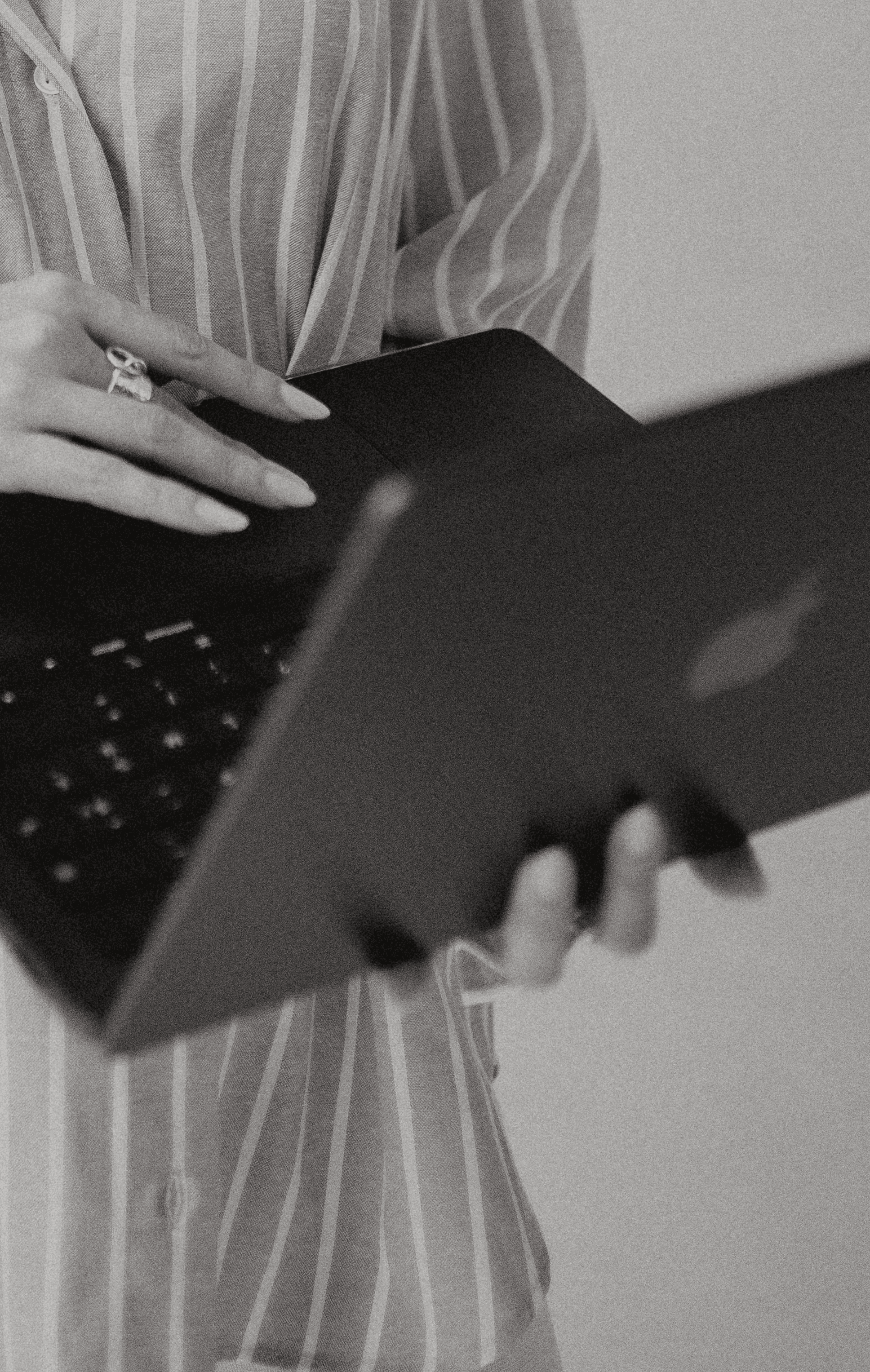 A close-up of a beige-colored laptop with a smooth, matte finish on a matching surface.