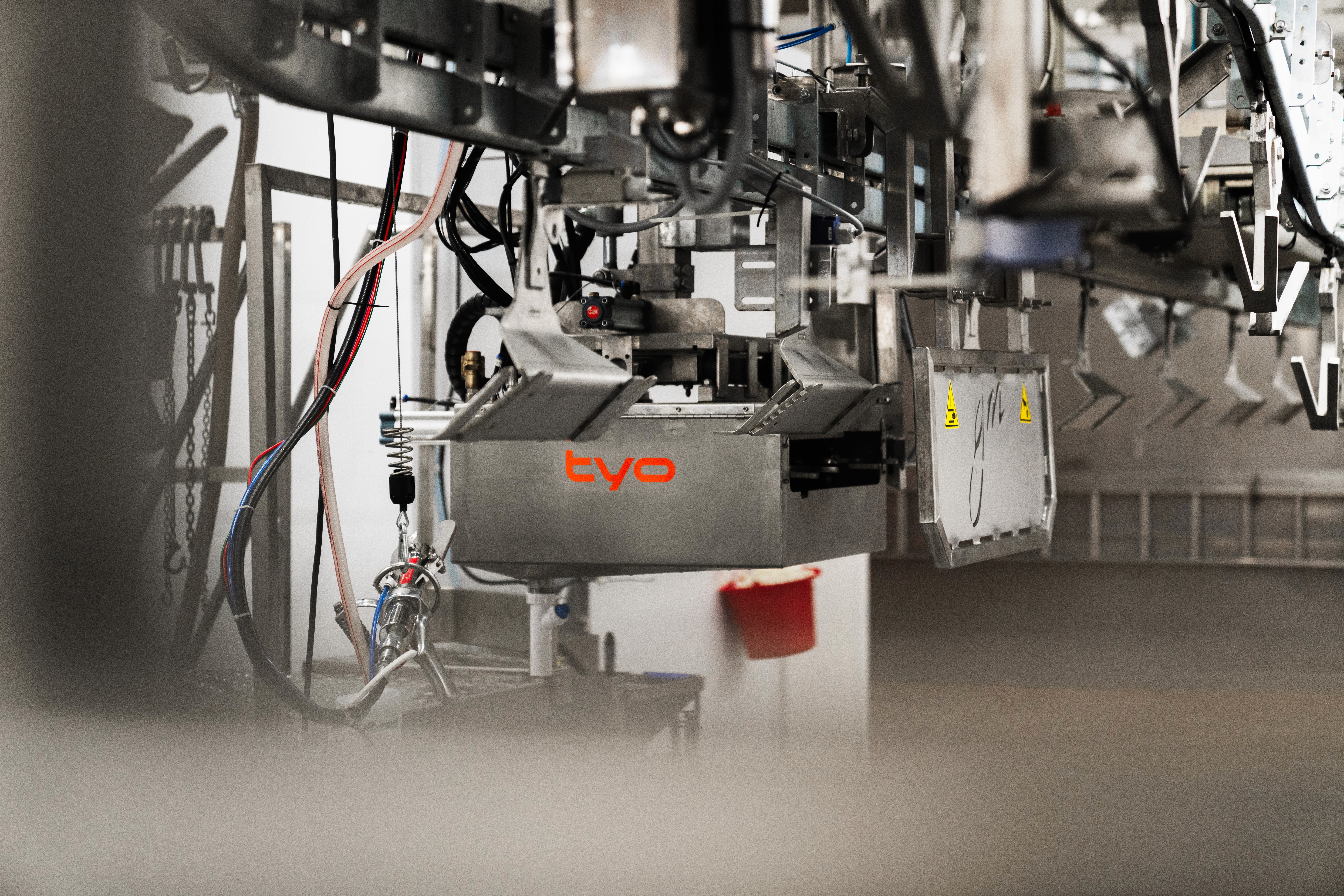 a factory filled with lots of orange machines