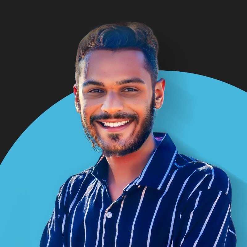 Profile portrait of a man in a white shirt against a light background