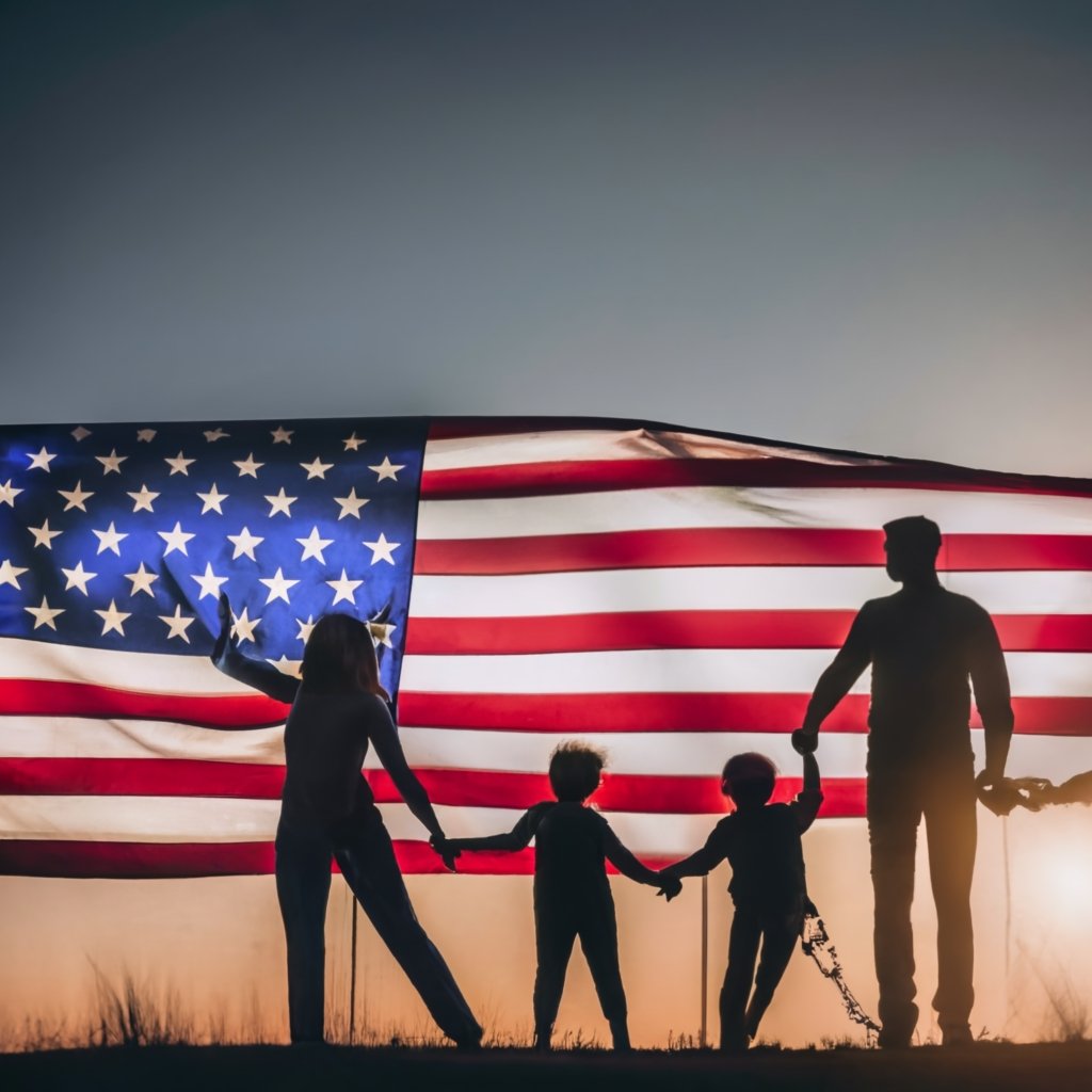 A silhouette of a person or family against a backdrop of the U.S. flag, symbolizing the protection and hope offered by the U Visa.