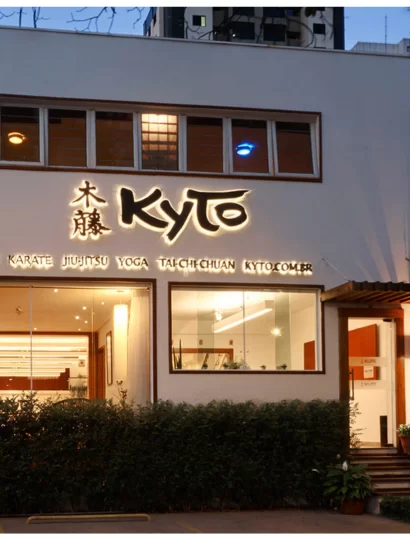 Modern martial arts training facility with boxing bags, training equipment and open floor space at Rai Martial Arts.