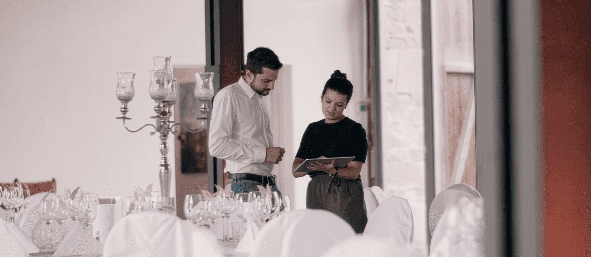 man wearing gray polo shirt beside dry-erase board