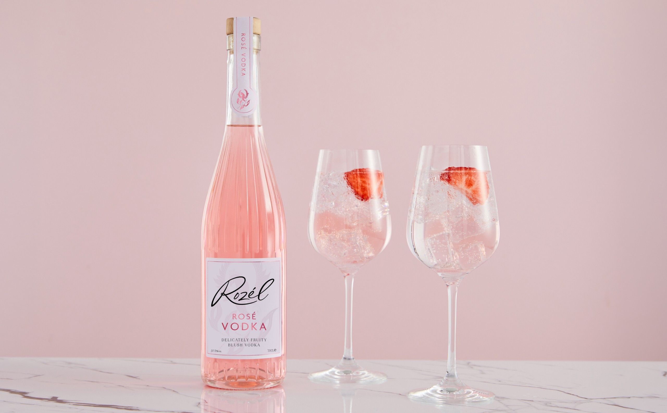 Rozel Vodka: Brand identity and packaging for Rozél Vodka, a rosé-infused spirit positioned as a light, colourful drink for relaxed summer occasions.