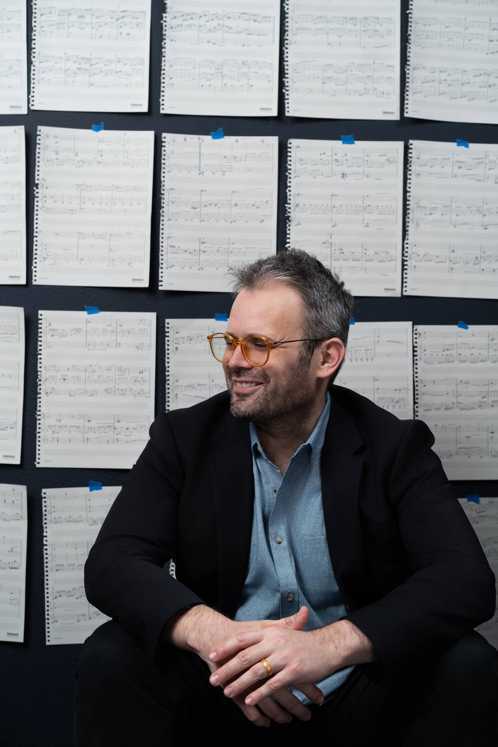 James Shields in front of a wall with sheet music taped on it