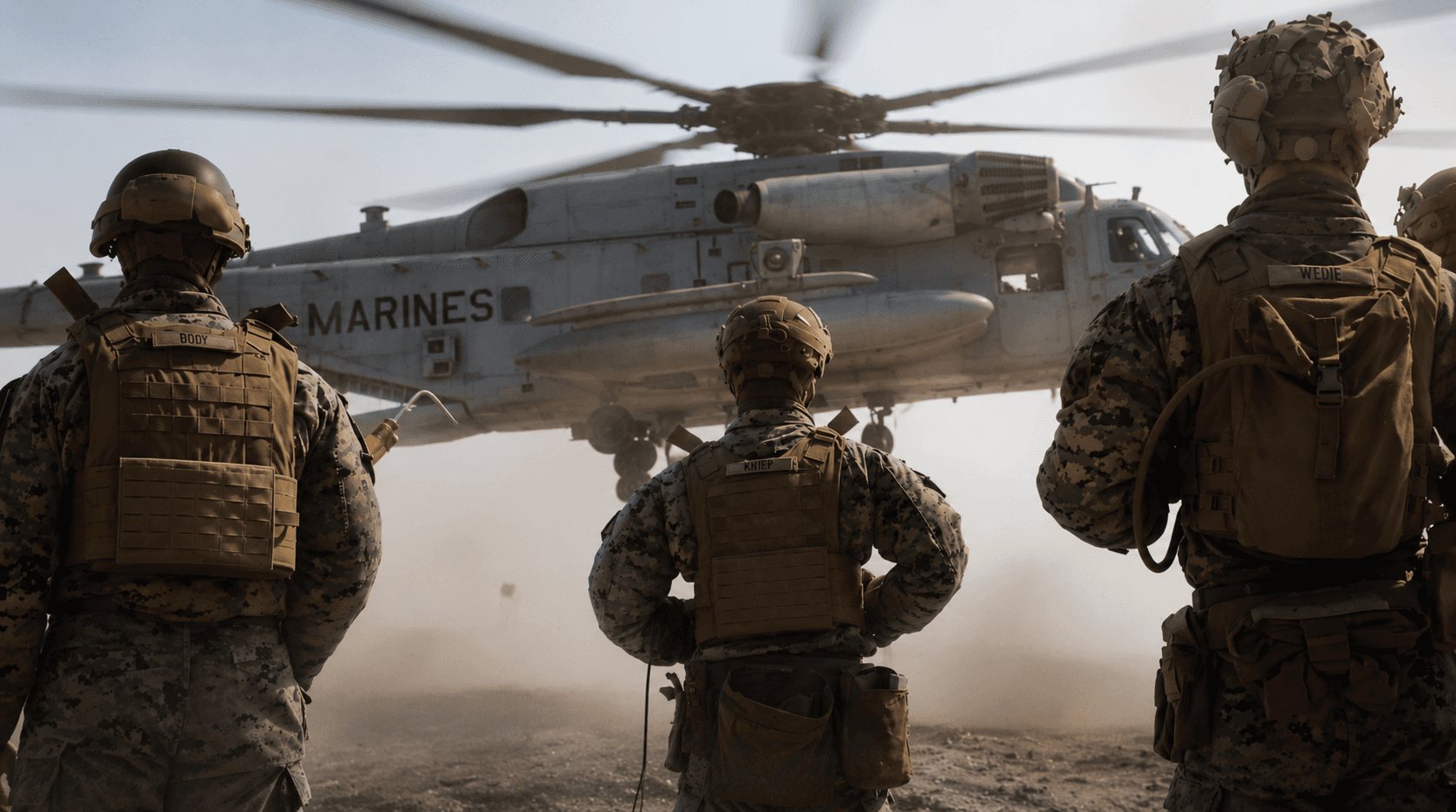 Marines looking up to a Marine helicopter for 250th Anniversary Broadcast