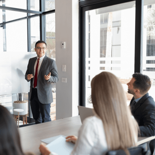 a person writing on a white board