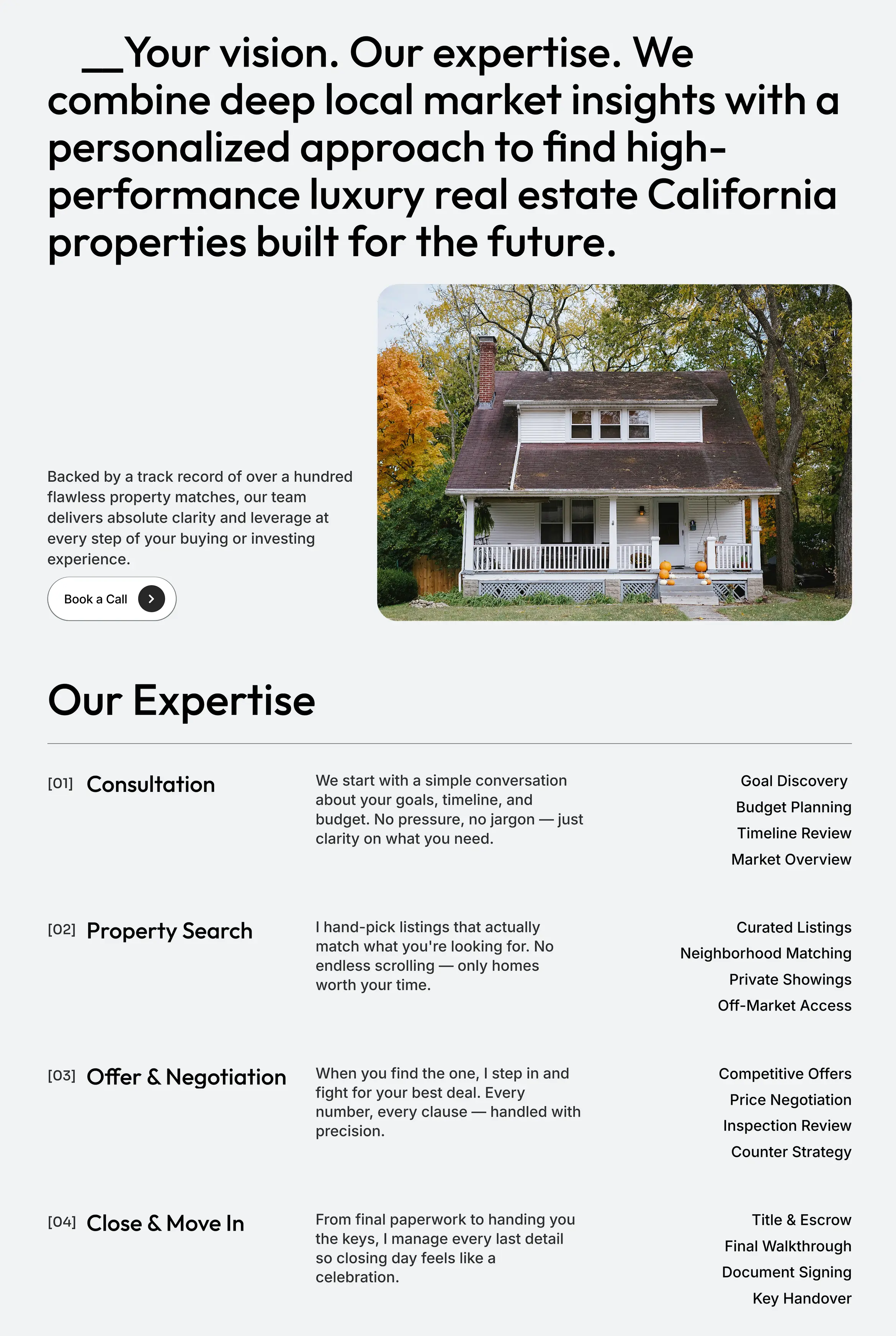 Premium website layout mockup showcasing luxury real estate branding with an image of a classic home surrounded by autumn trees.