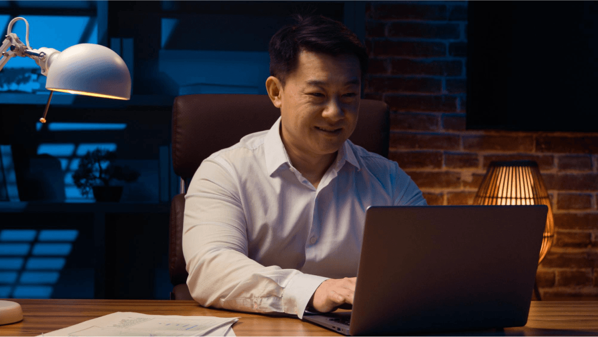 happy man using laptop