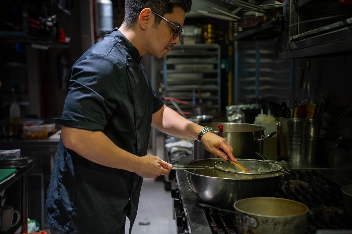 Jan Rodriguez, owner of The Weekend and Ilaputi, cooking food