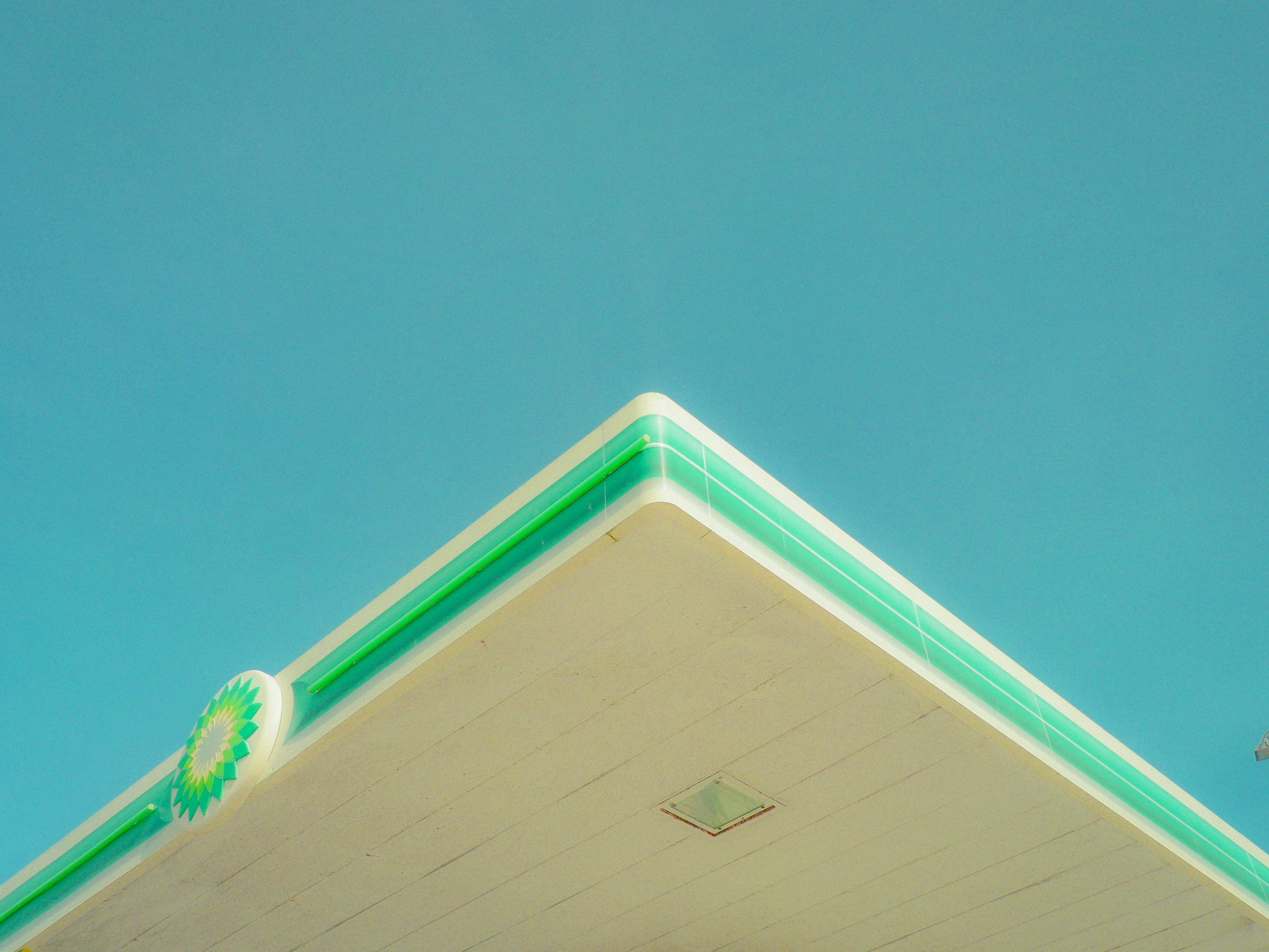 A bp gas station awning points towards the sky.
