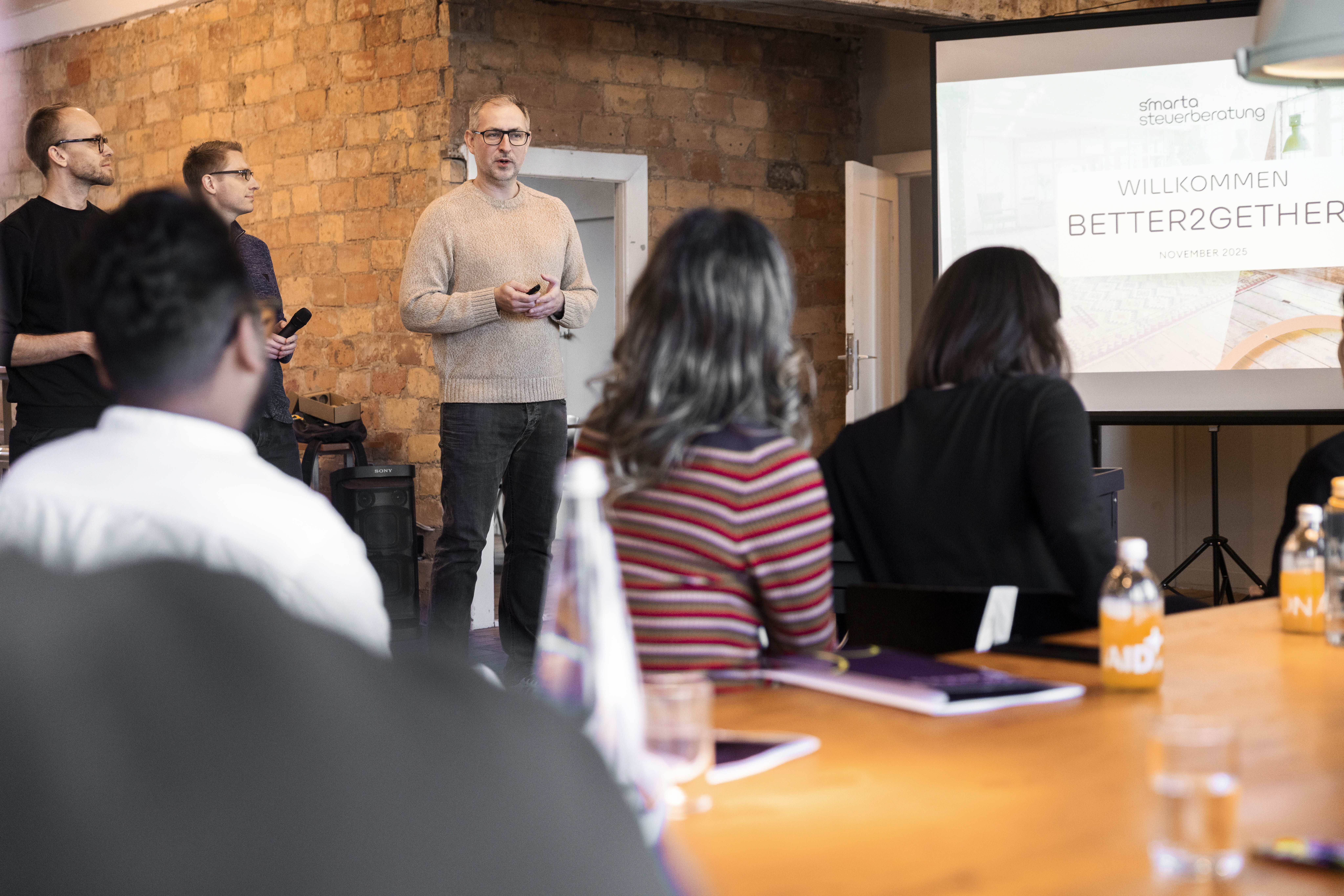 man in blue dress shirt and woman in black long sleeve shirt