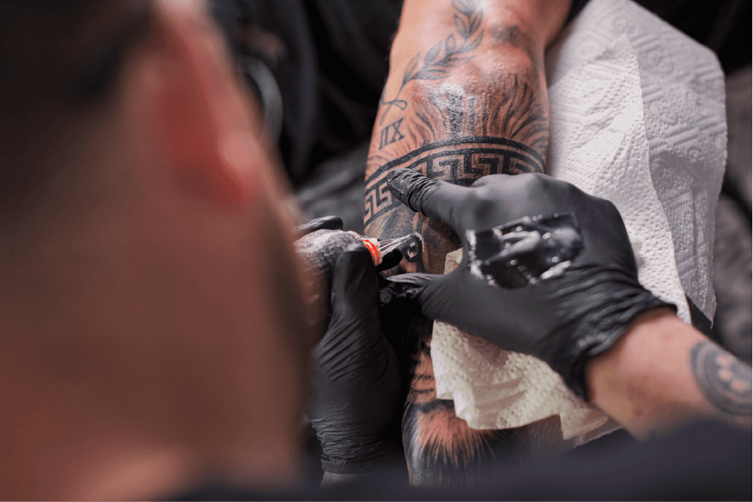 Man giving tattoo