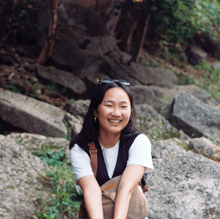 White pole with security cameras against blue sky