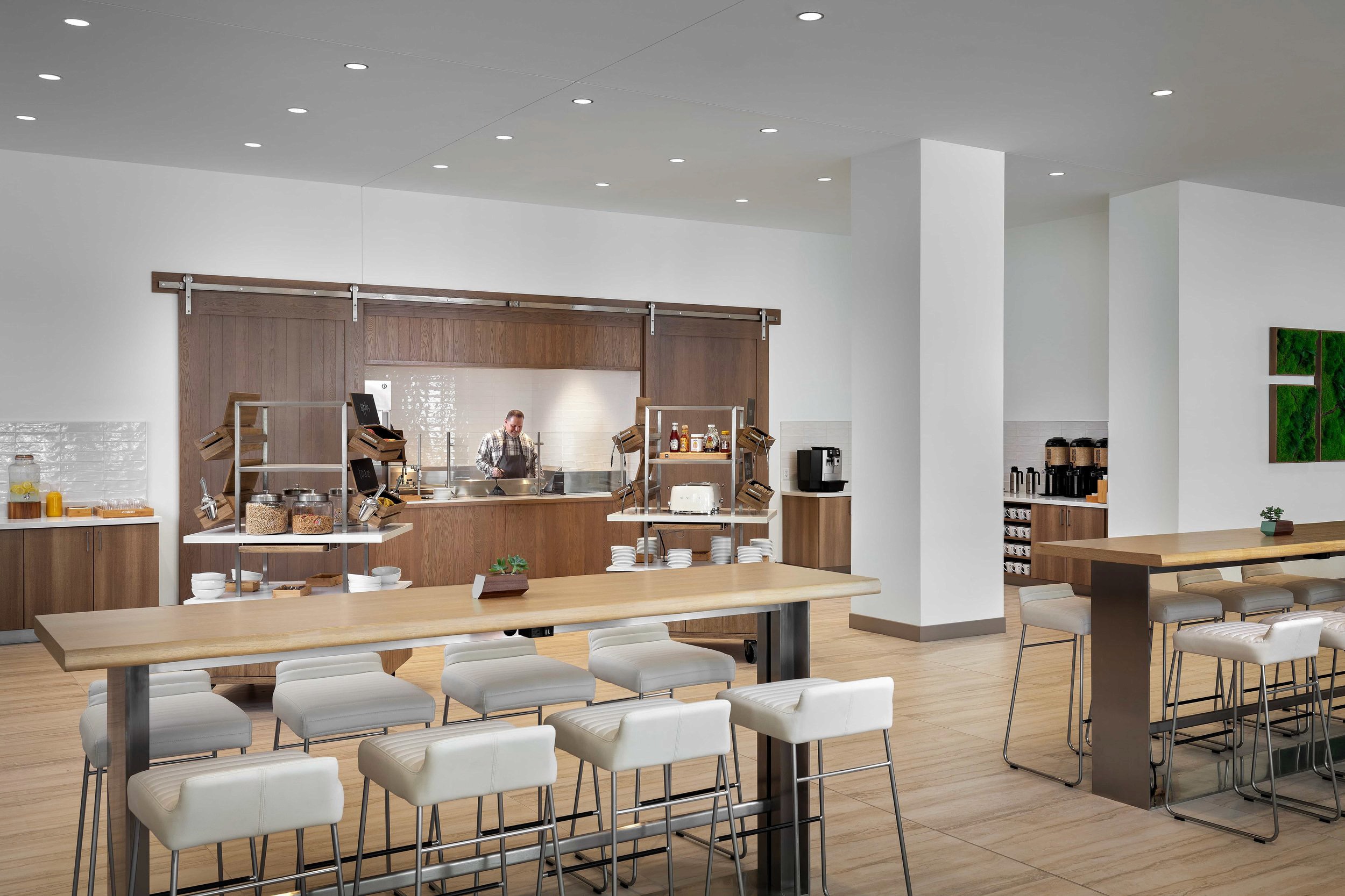 Hotel breakfast buffet with food stations and seating