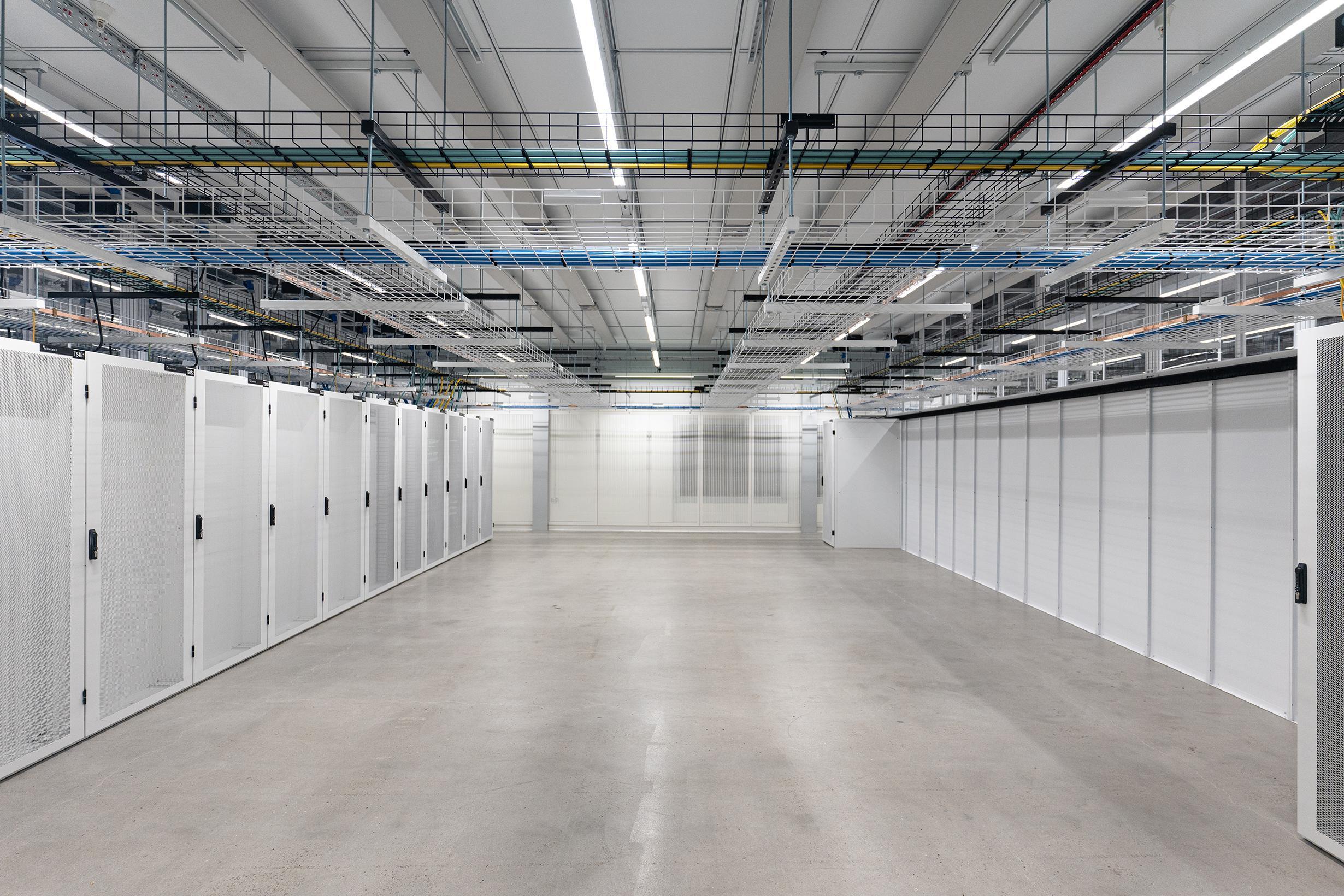 a room with a lot of shelves and ladders