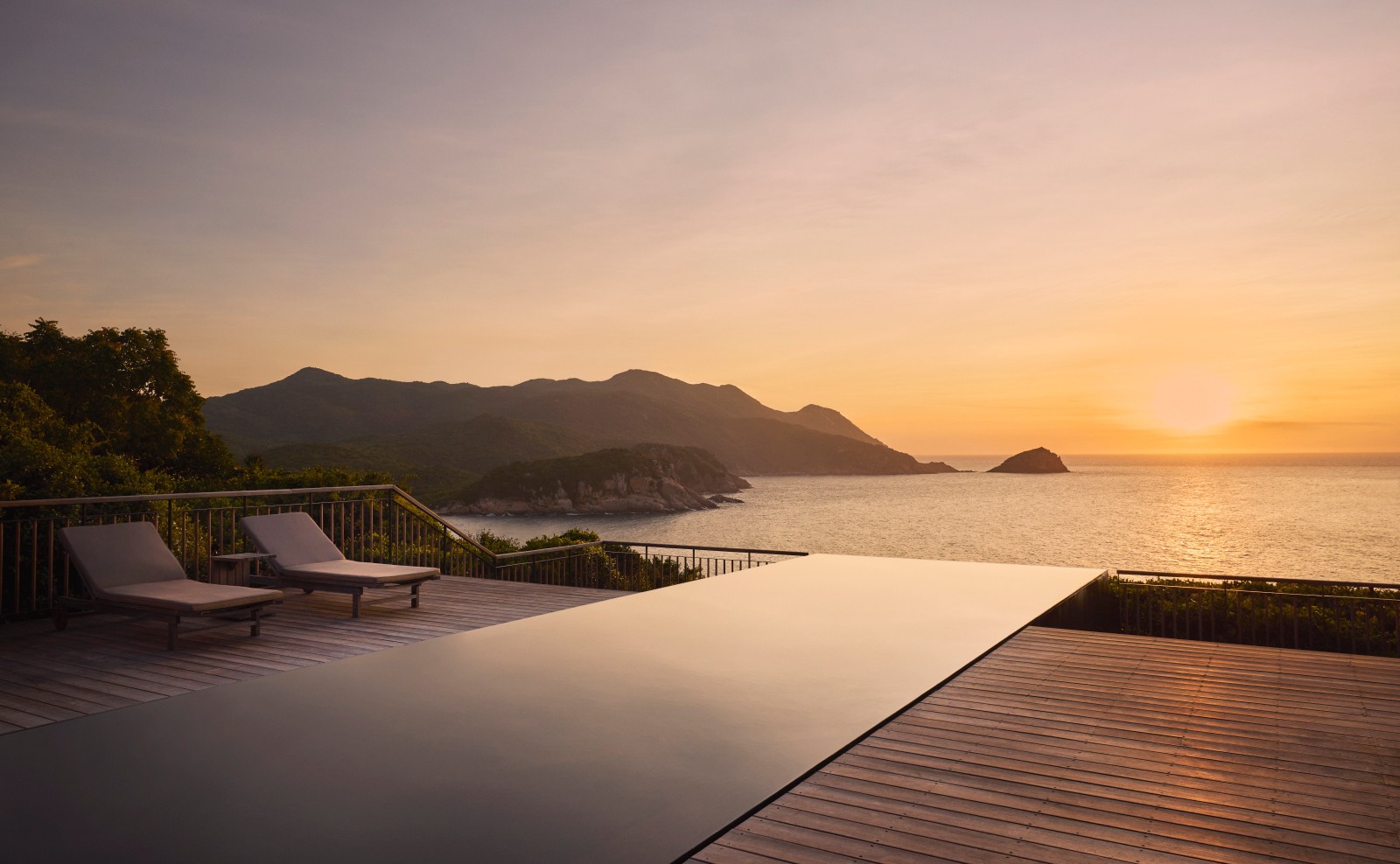 Ocean pool villa at Amanoi overlooking the Vietnamese coast at sunset