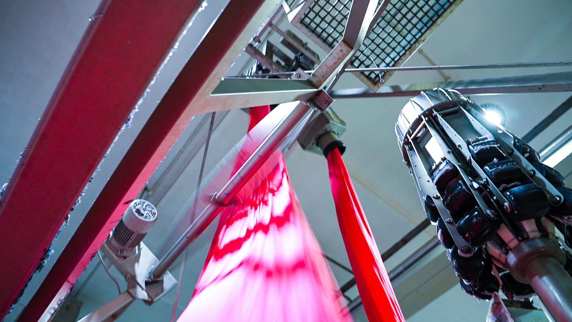 Pink fabric on rollers