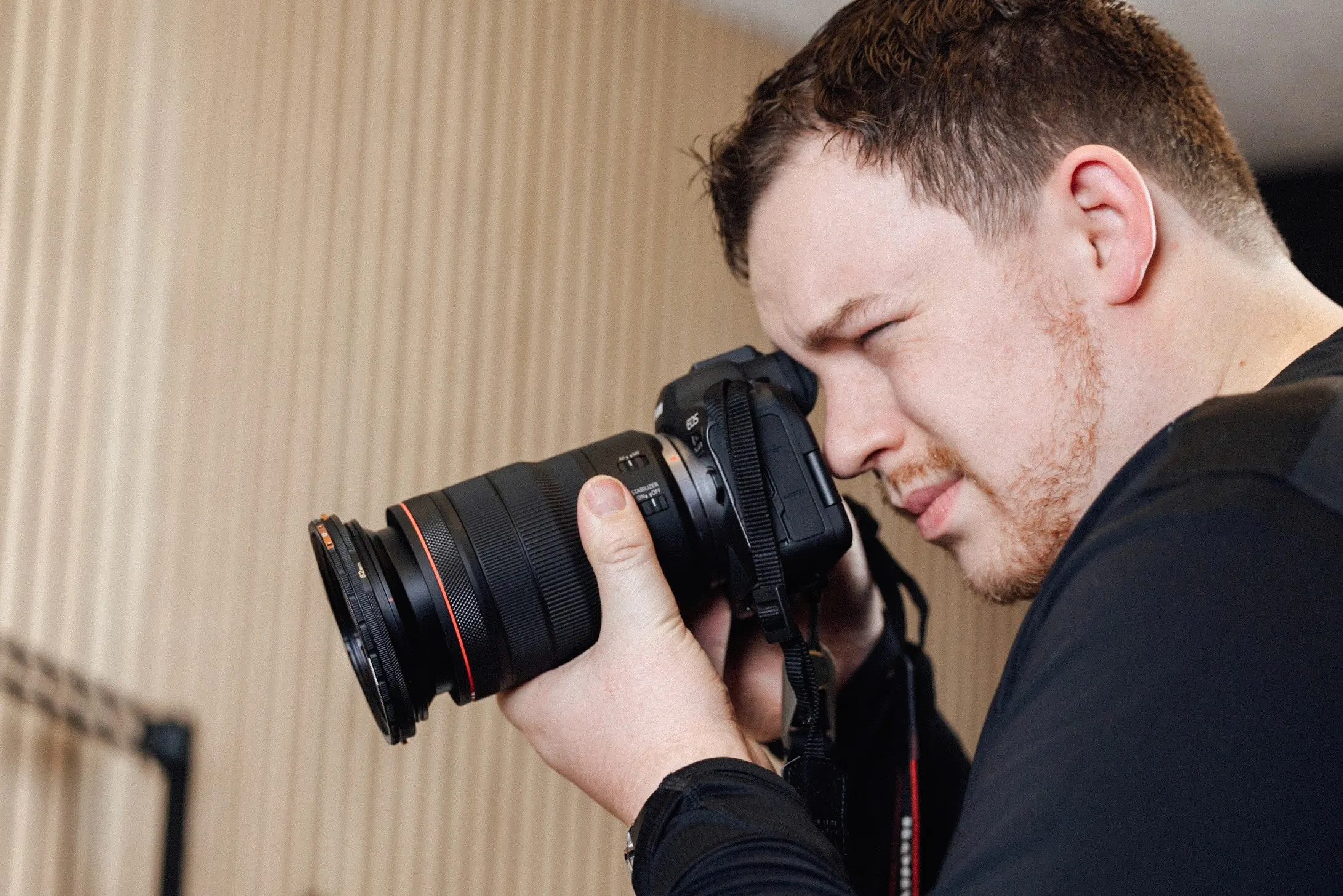 Photo of a photographer with a Canon camera.