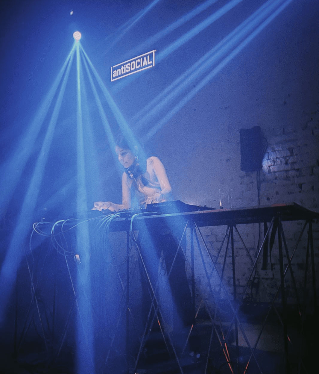 Friends laughing and posing inside a car