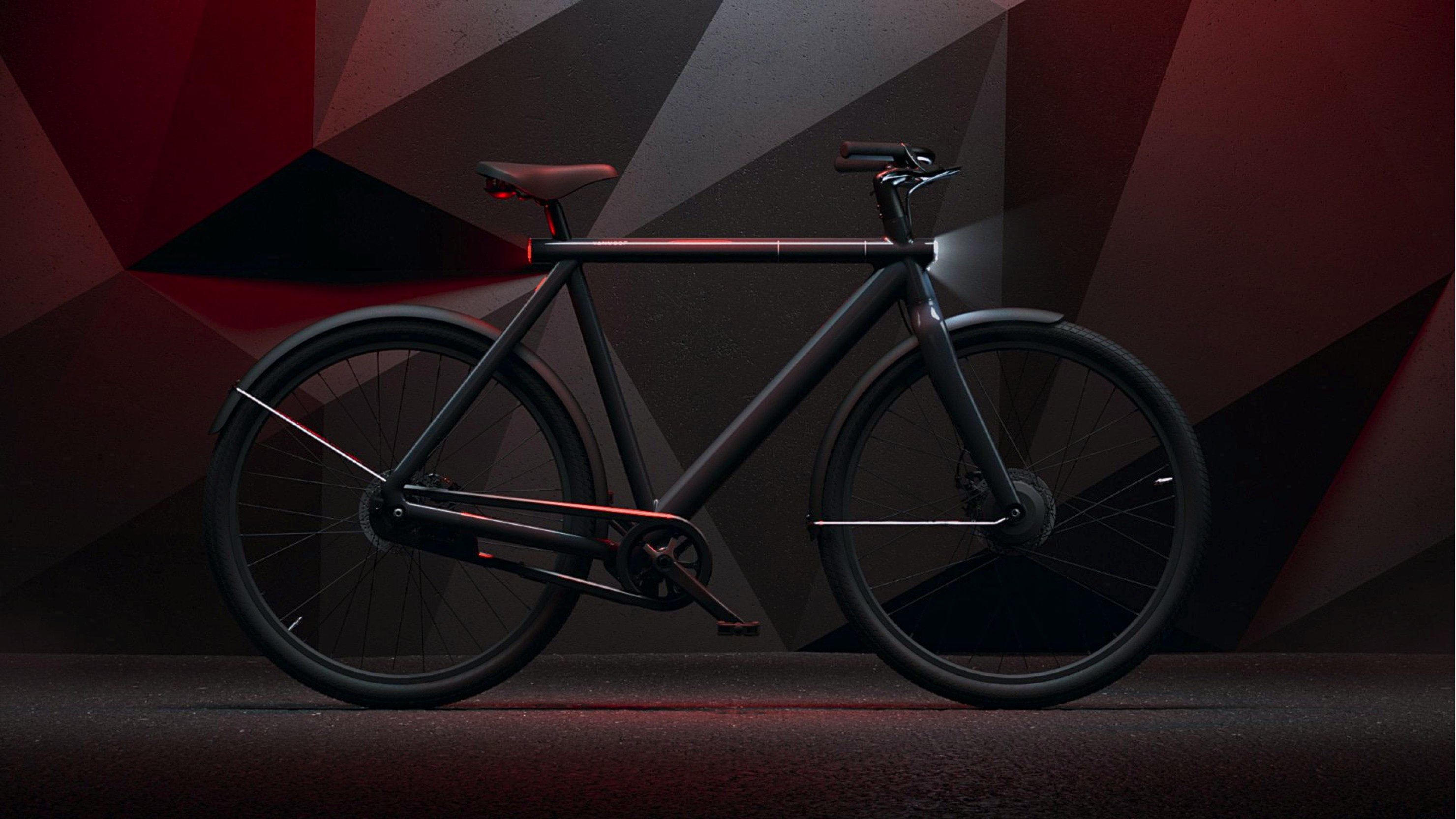 VanMoof — sleek black VanMoof electric bicycle in profile against a dark geometric background with red accents — Soda Studio case study