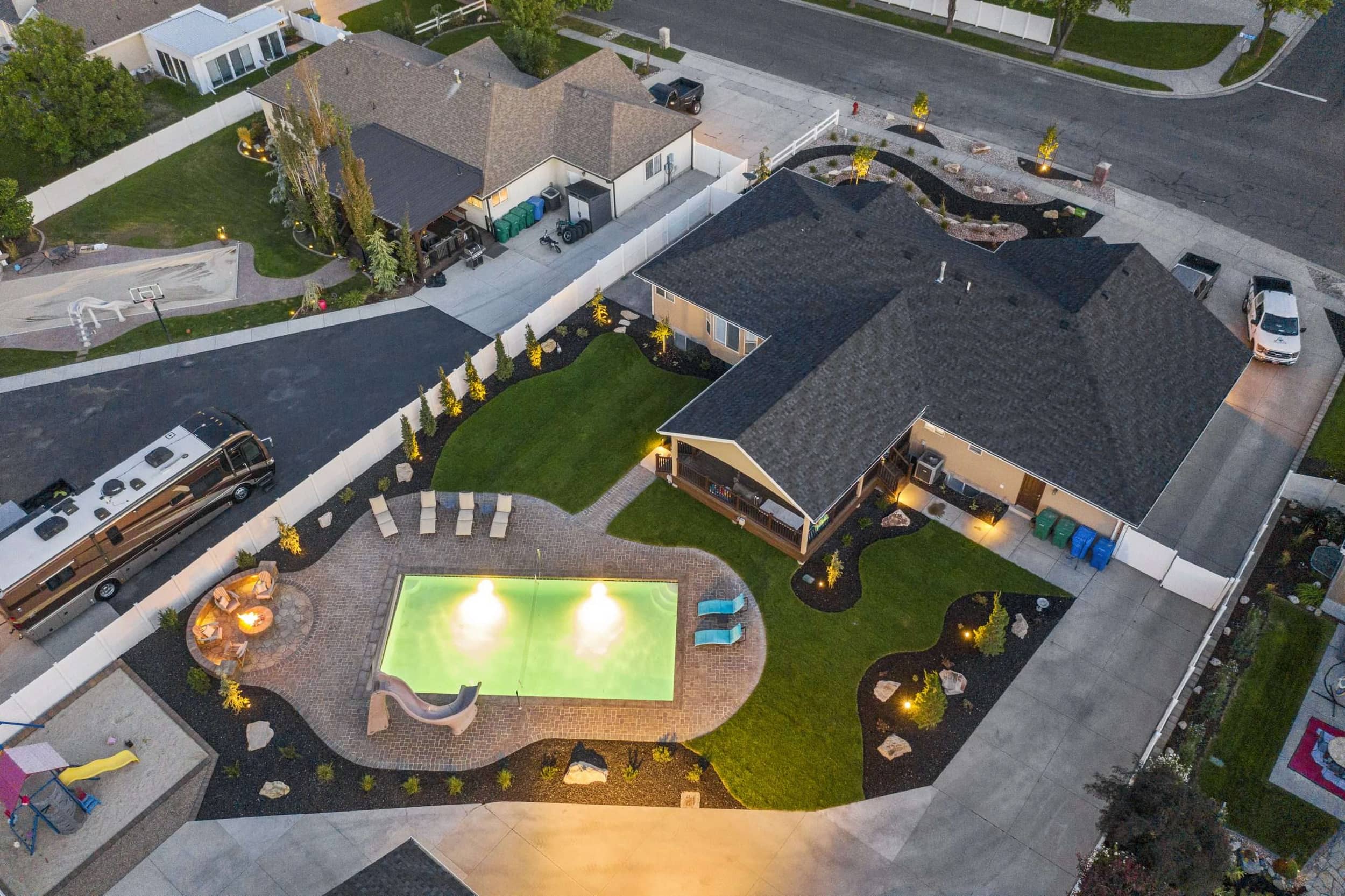 Riverton Residence full-property aerial showing finished front xeriscape and backyard pool
