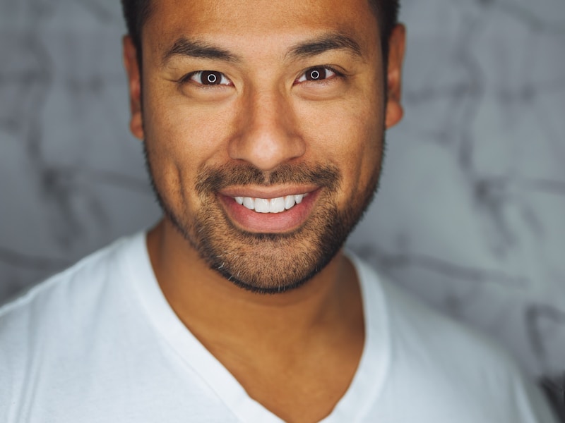 red train travelling near body of water