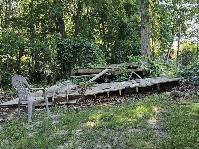 Before: demolished deck debris pile