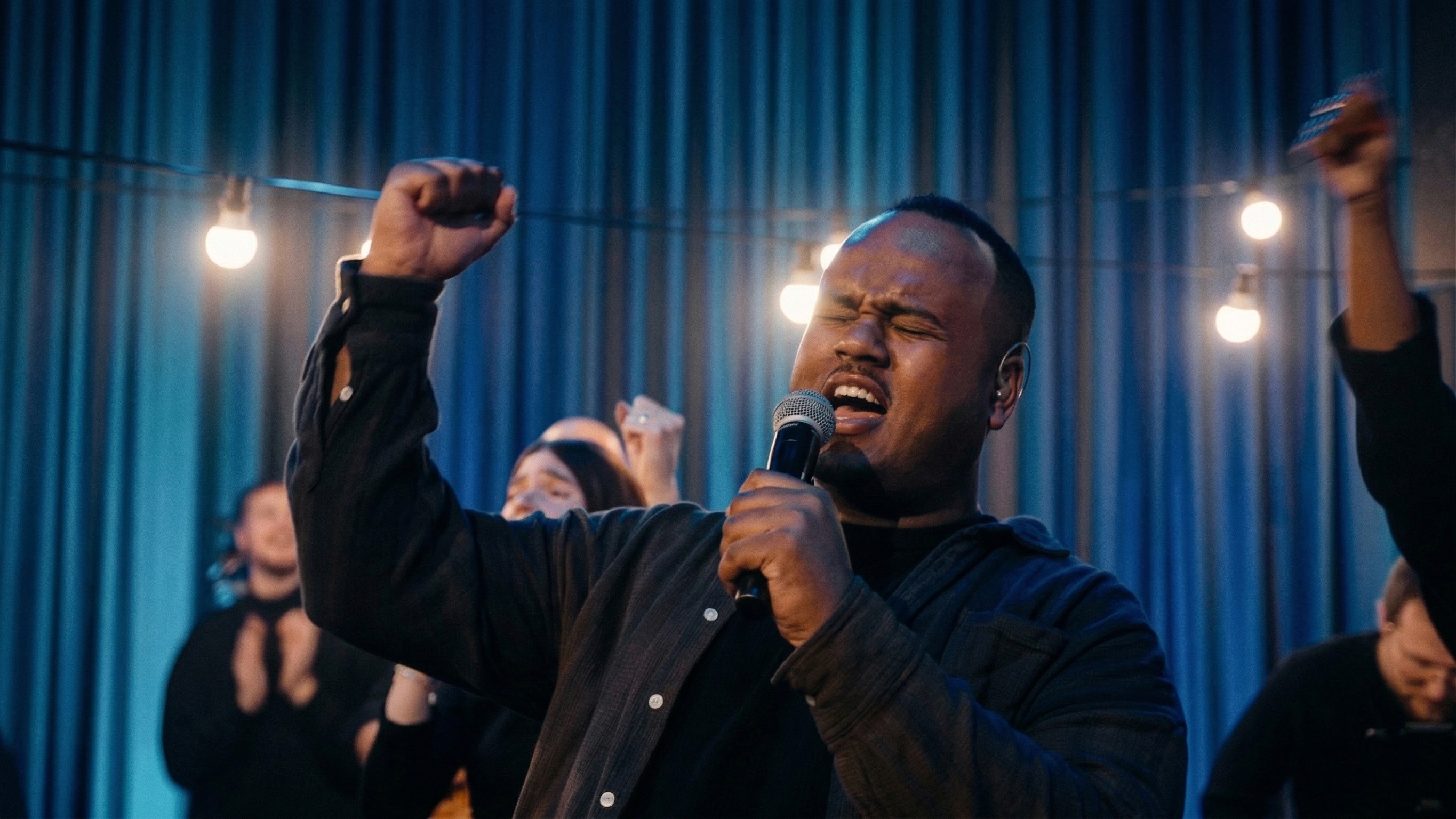 Excited crowd at a colorful concert