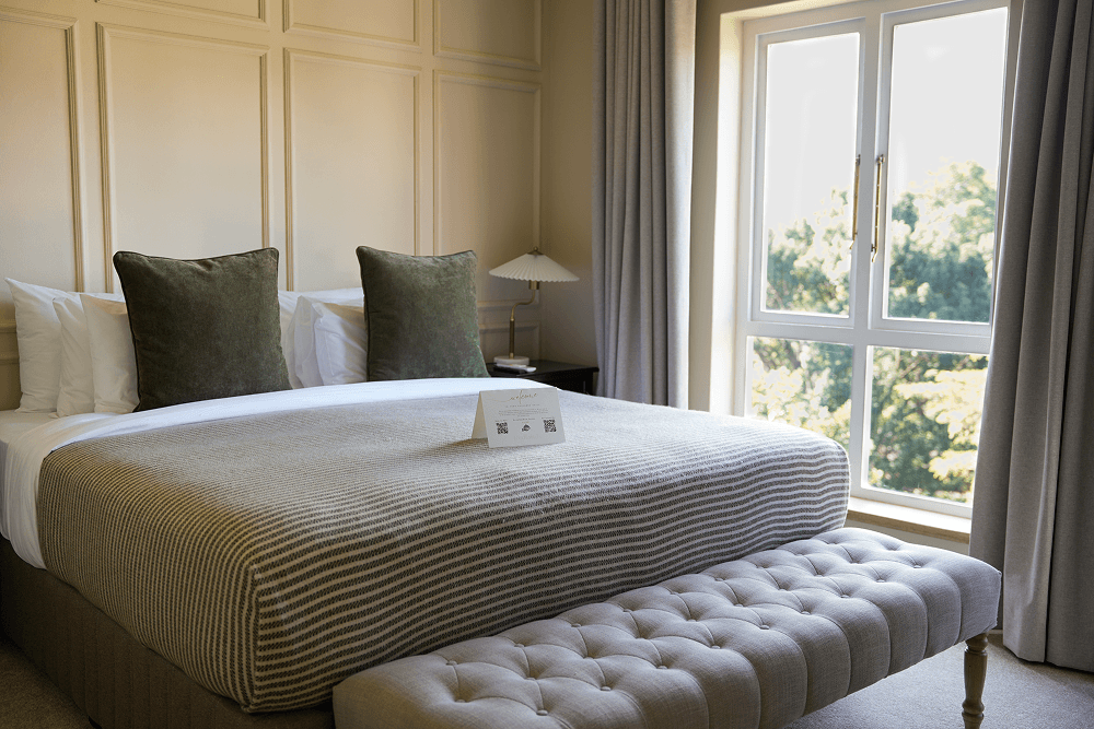Private lounge area in Premier Room with comfortable seating and work space.