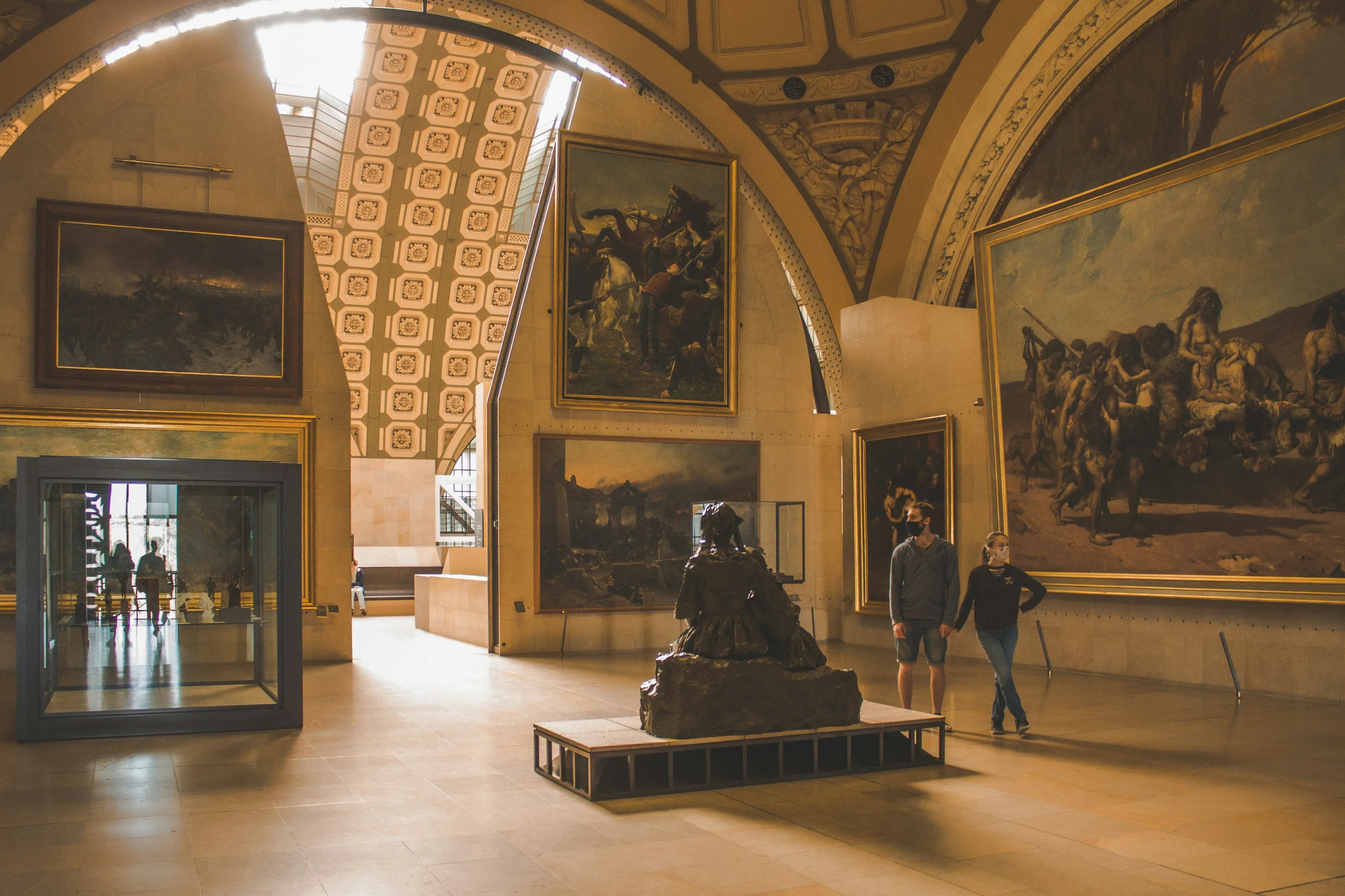 Paintings hanging in a gallery within the Musee d'Orsay