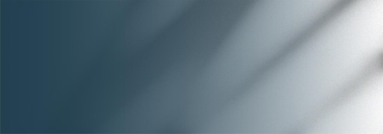 A person stands in a sandstone cave.