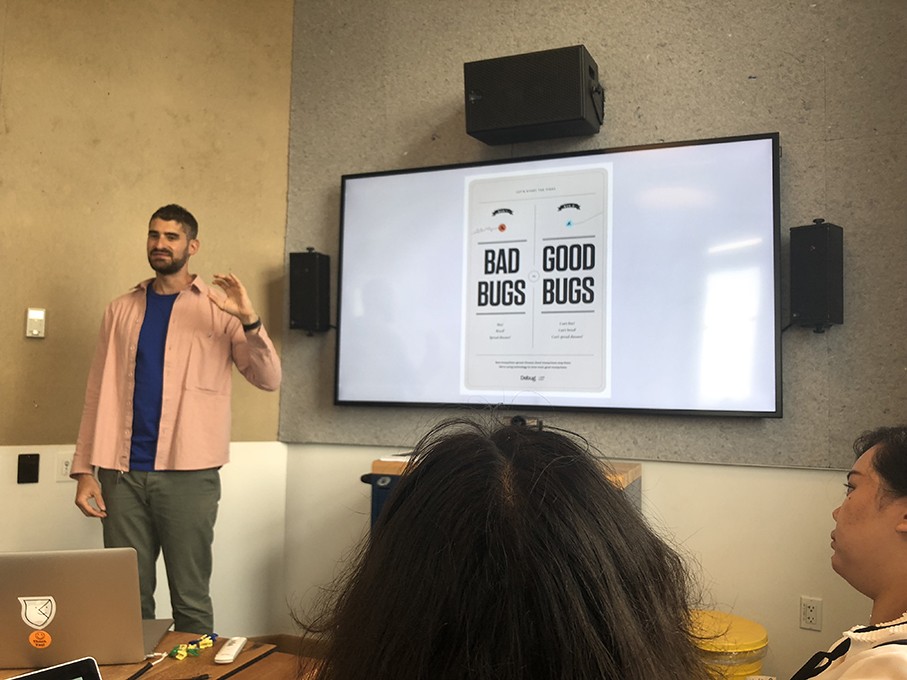 a course class with students and the teacher presenting the design lesson