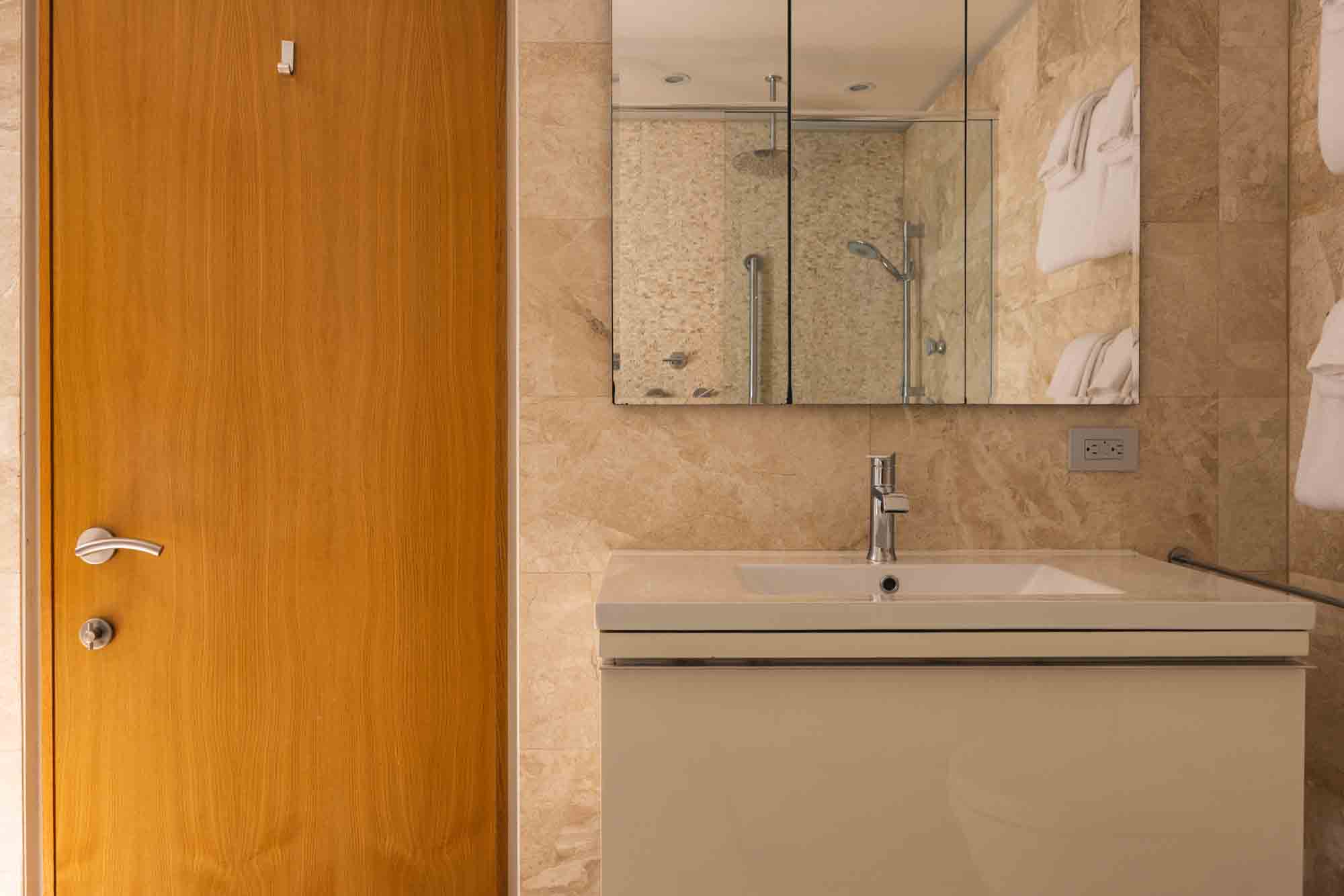 bright and spacious bathroom at Contra House, perfect for group stays in a private Key West retreat