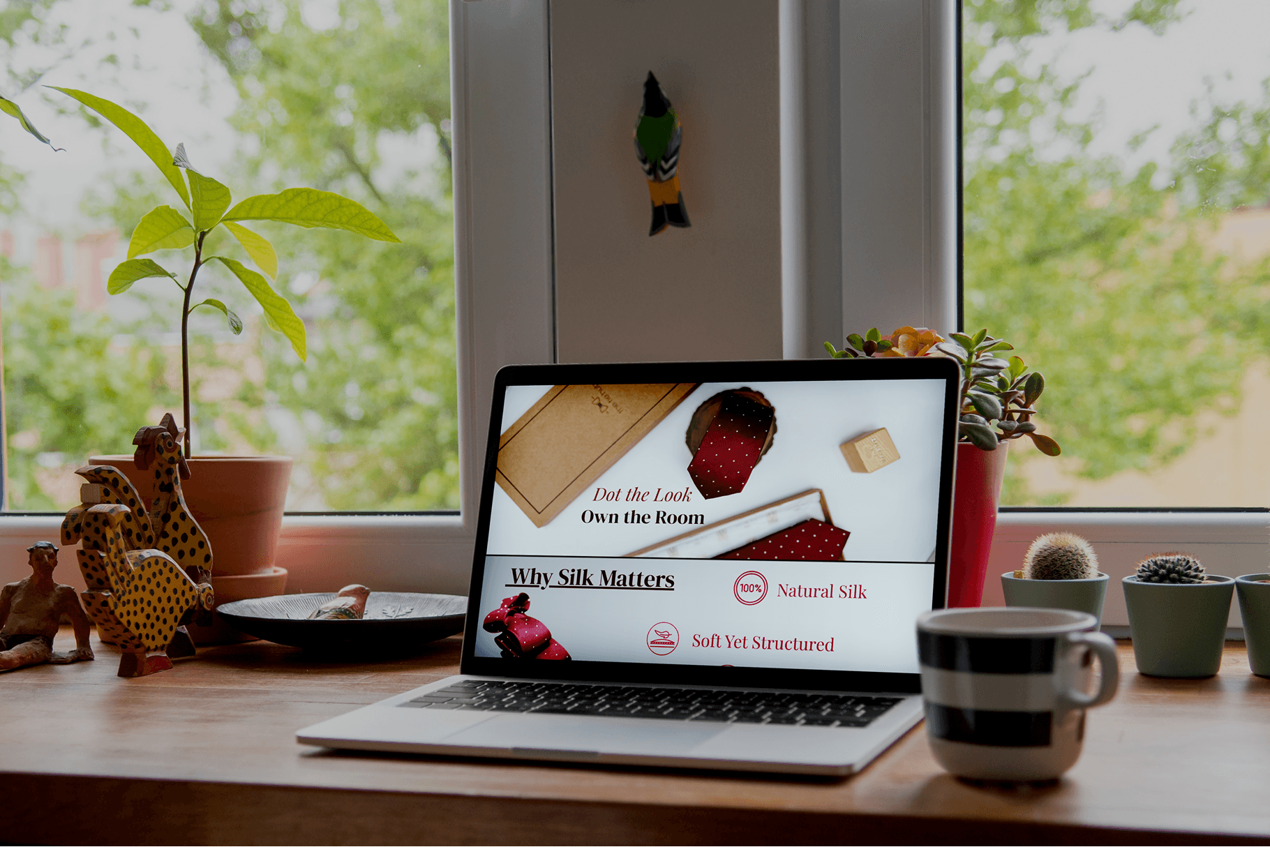 Woman holding a red flower with eyes closed
