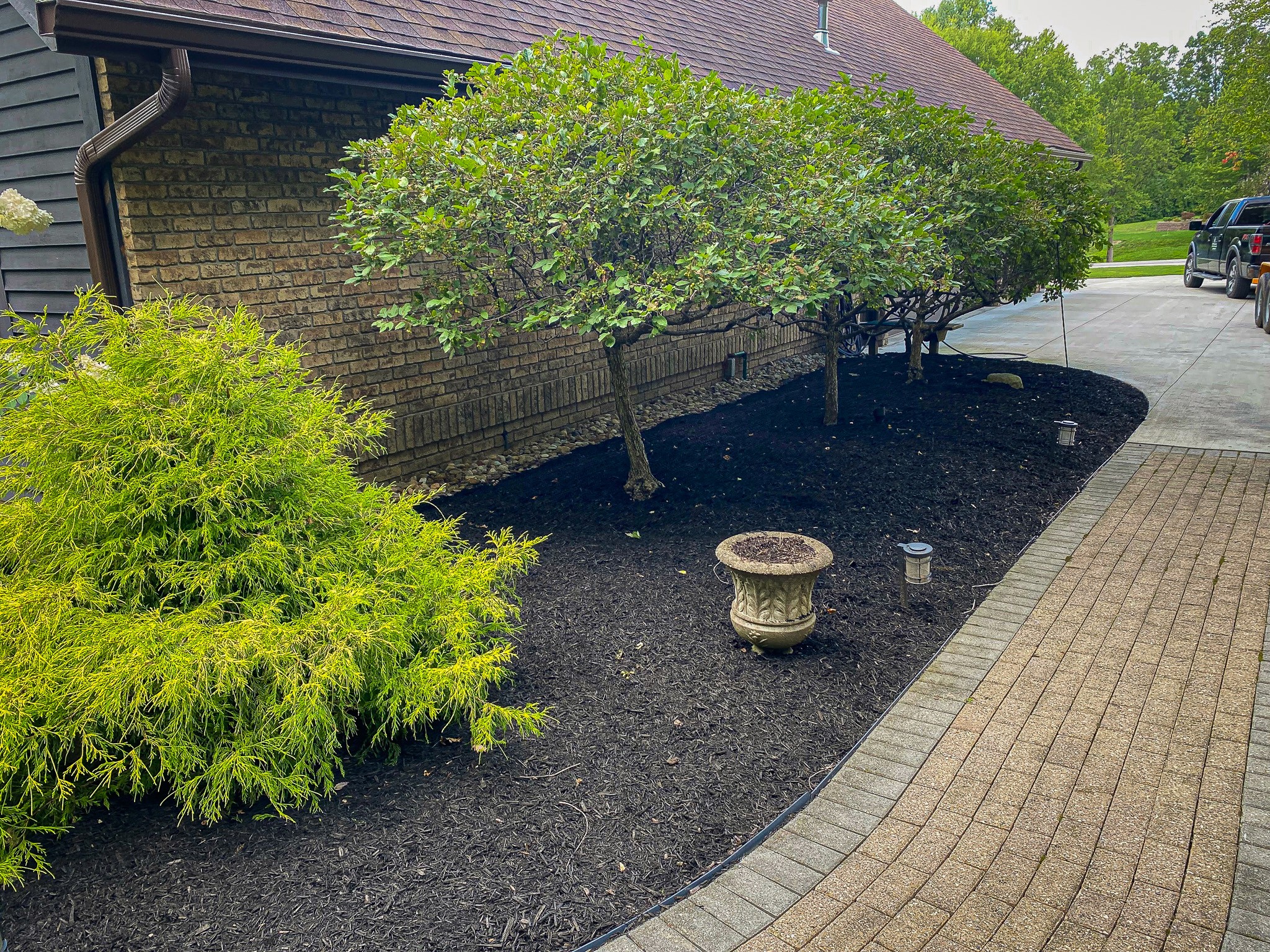 New mulch on the side of a house