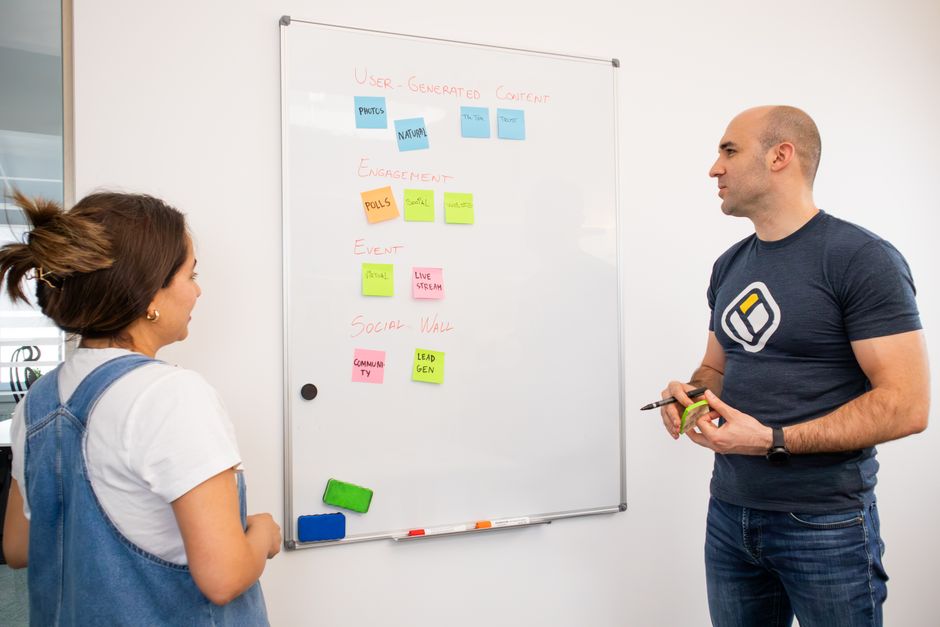 A creative team brainstorming session with whiteboards and storyboards
