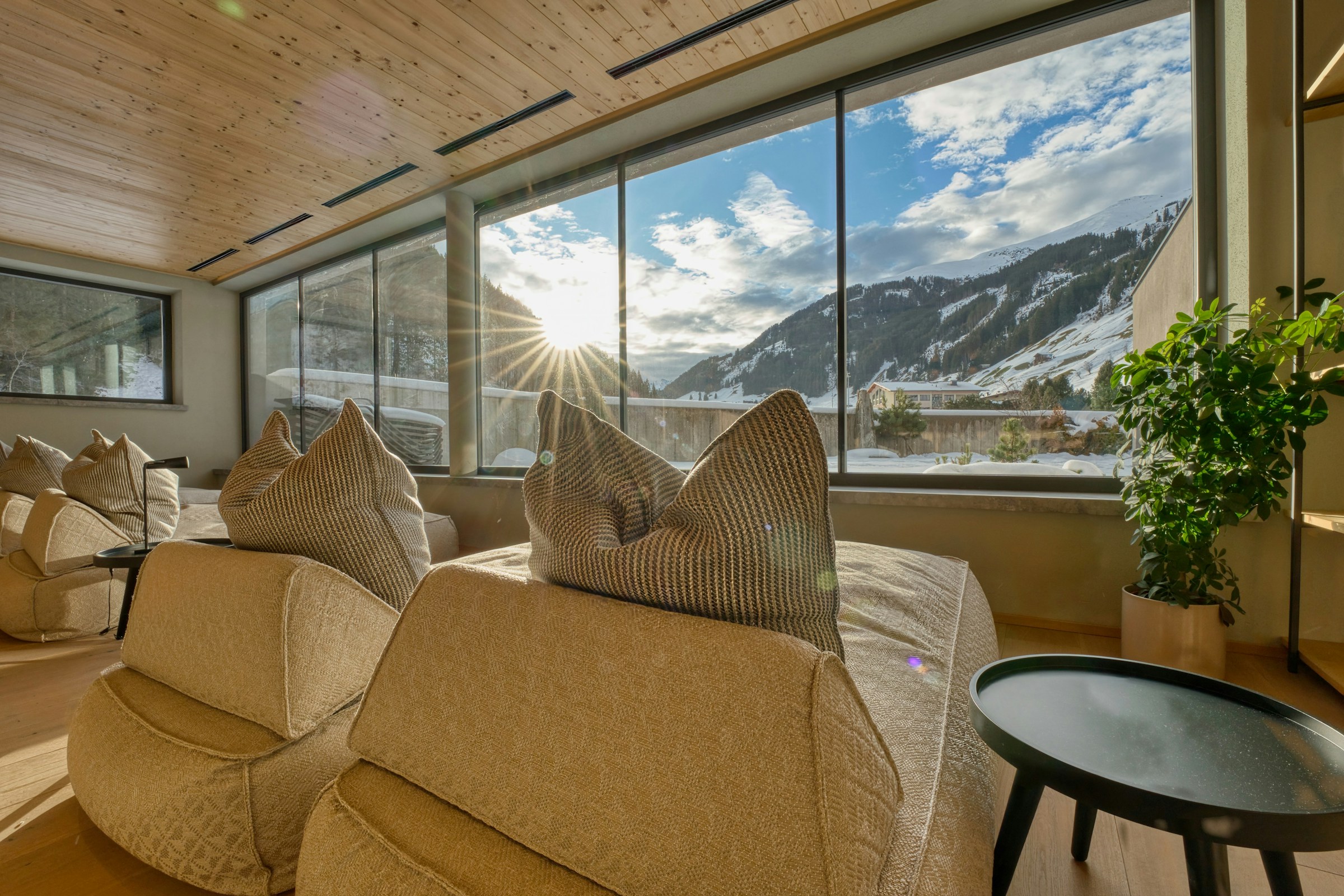 Relaxing lounge chairs in a sunlit spa room.