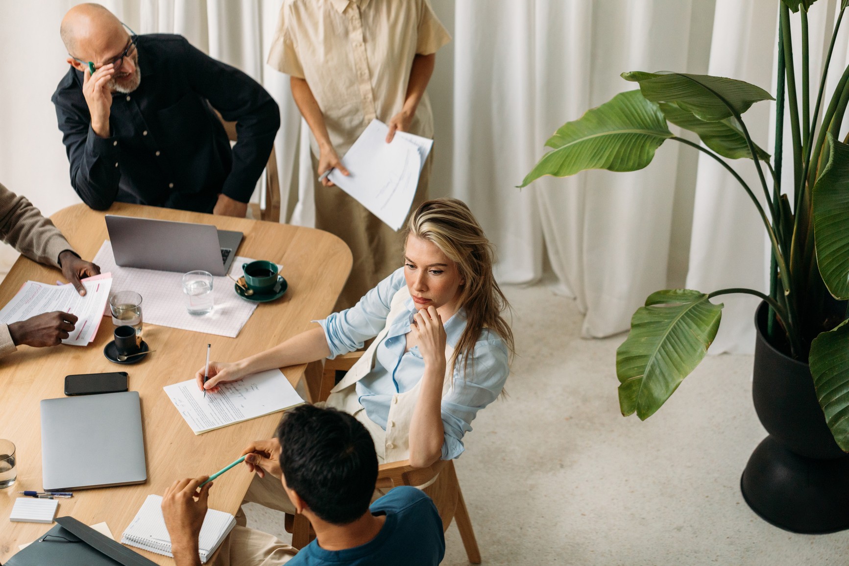Woman meeting with coworkers