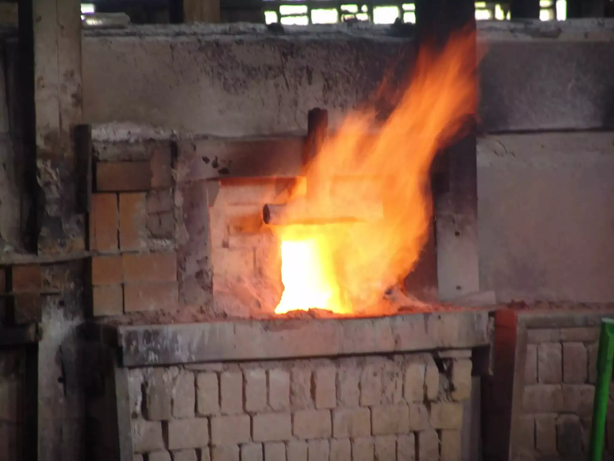Vibrant glass tile and smalti fire in mosaic art studio kiln.