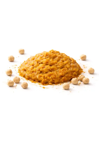 isolated MISO paste with scattered garbanzo beans on a white background.