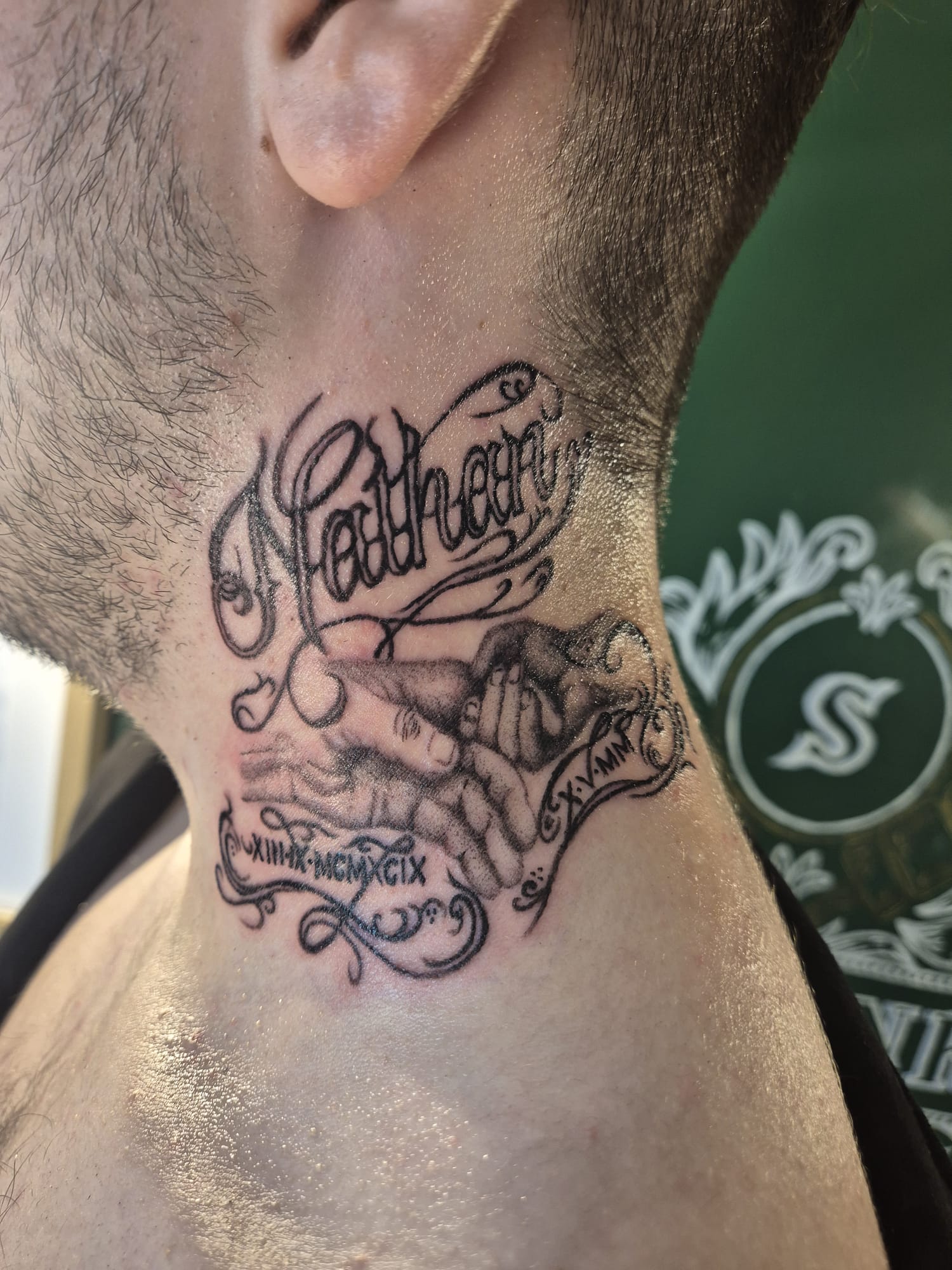 Black and grey mandala tattoo on chest in Hazel Grove