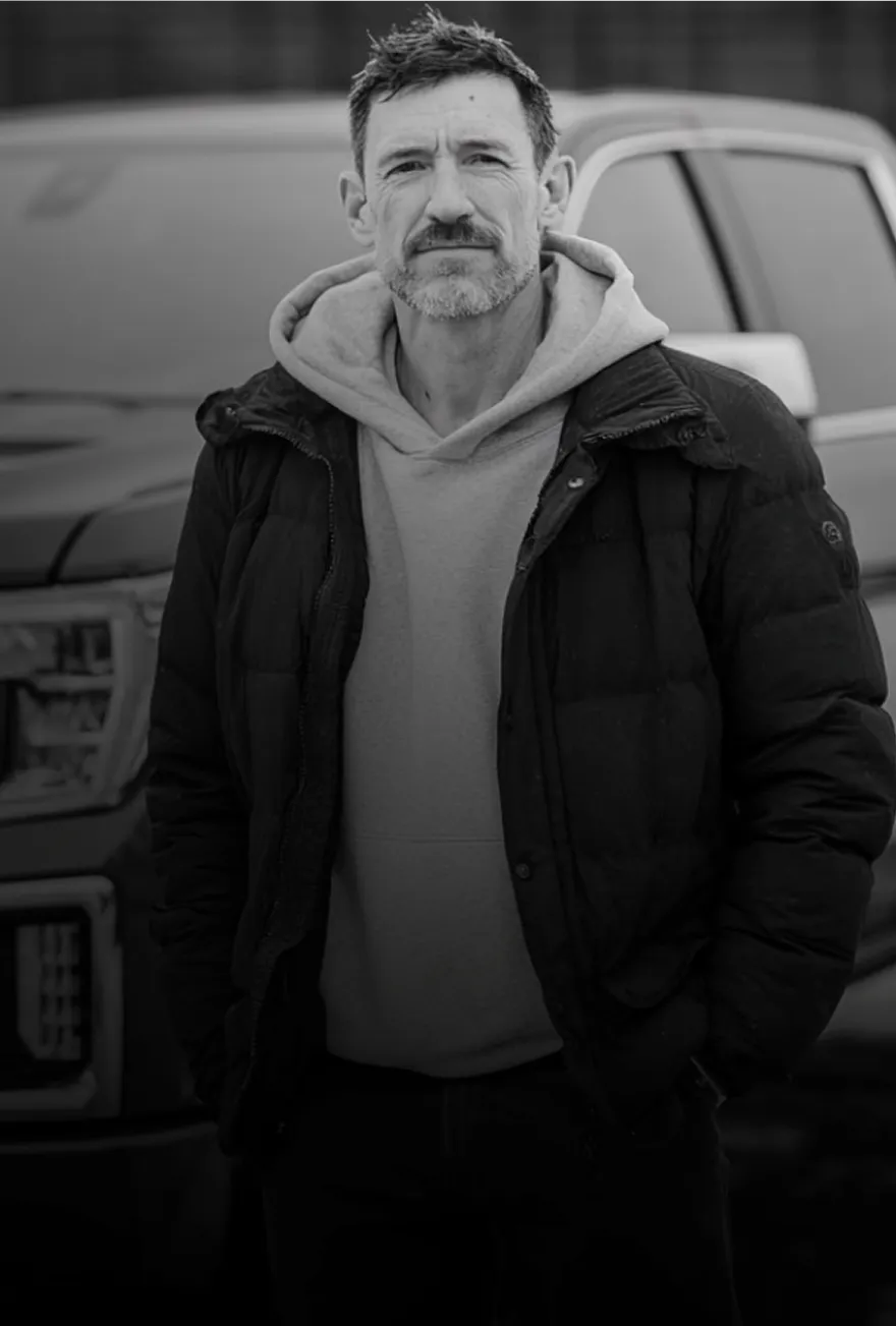 Operator portrait in front of work truck