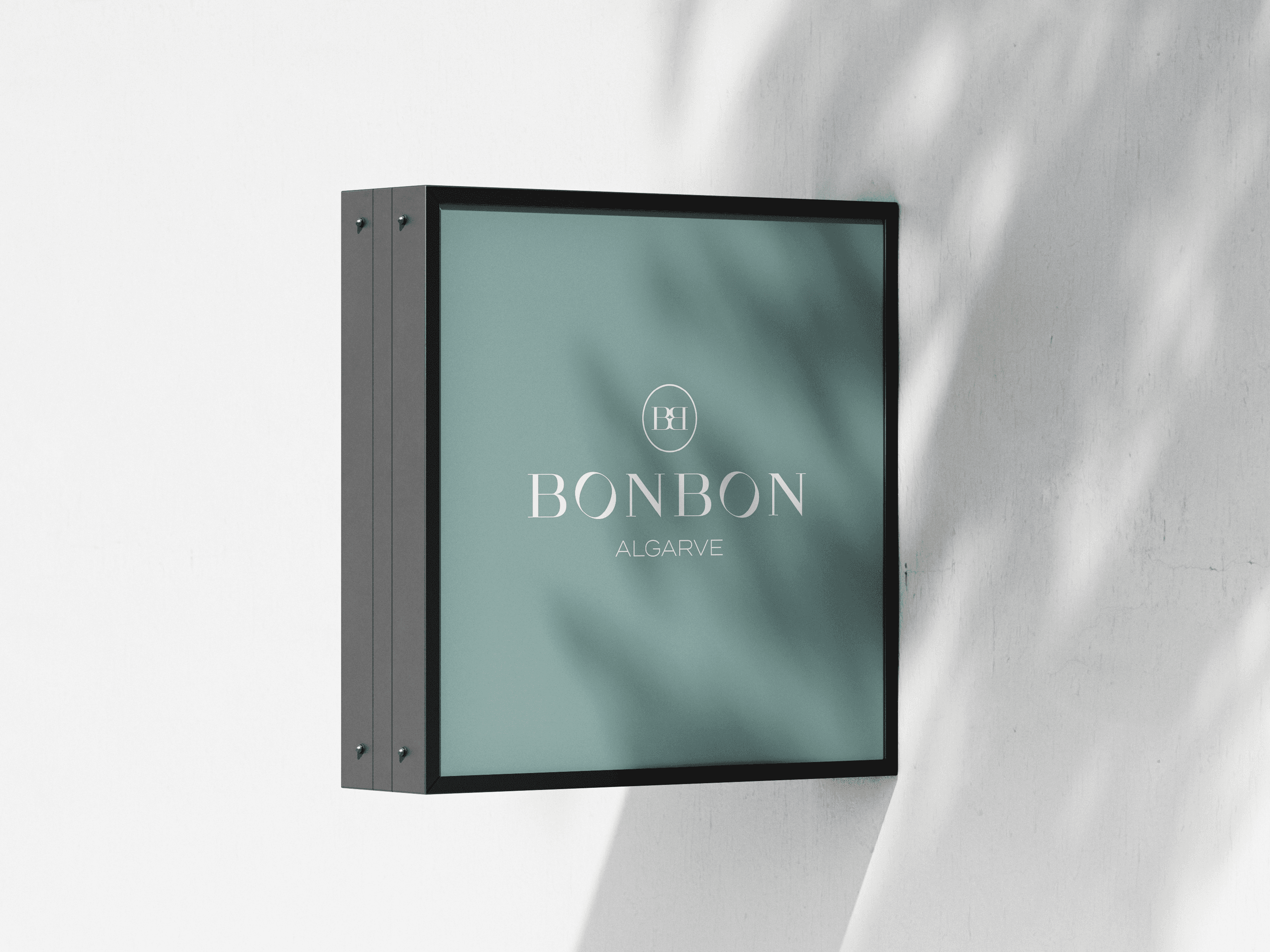 Close-up of a yellow tennis ball sitting on a green court, positioned near the white center line.