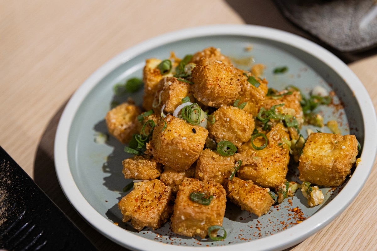 Crispy fried tofu cubes topped with green onions